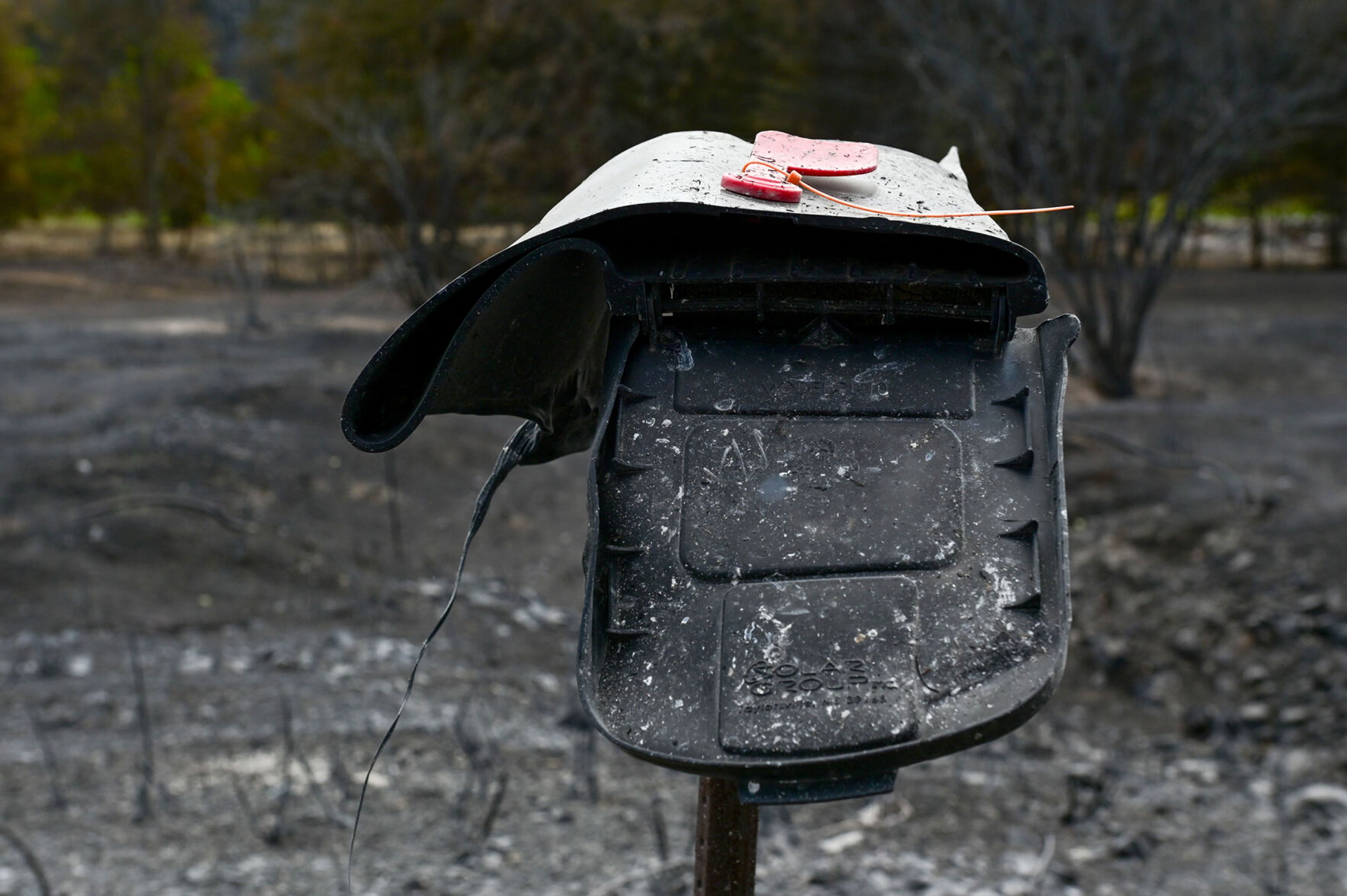 A mailbox takes on a new shape on Monday after being melted in the Gwen Fire along Idaho Highway 3 in Juliaetta.