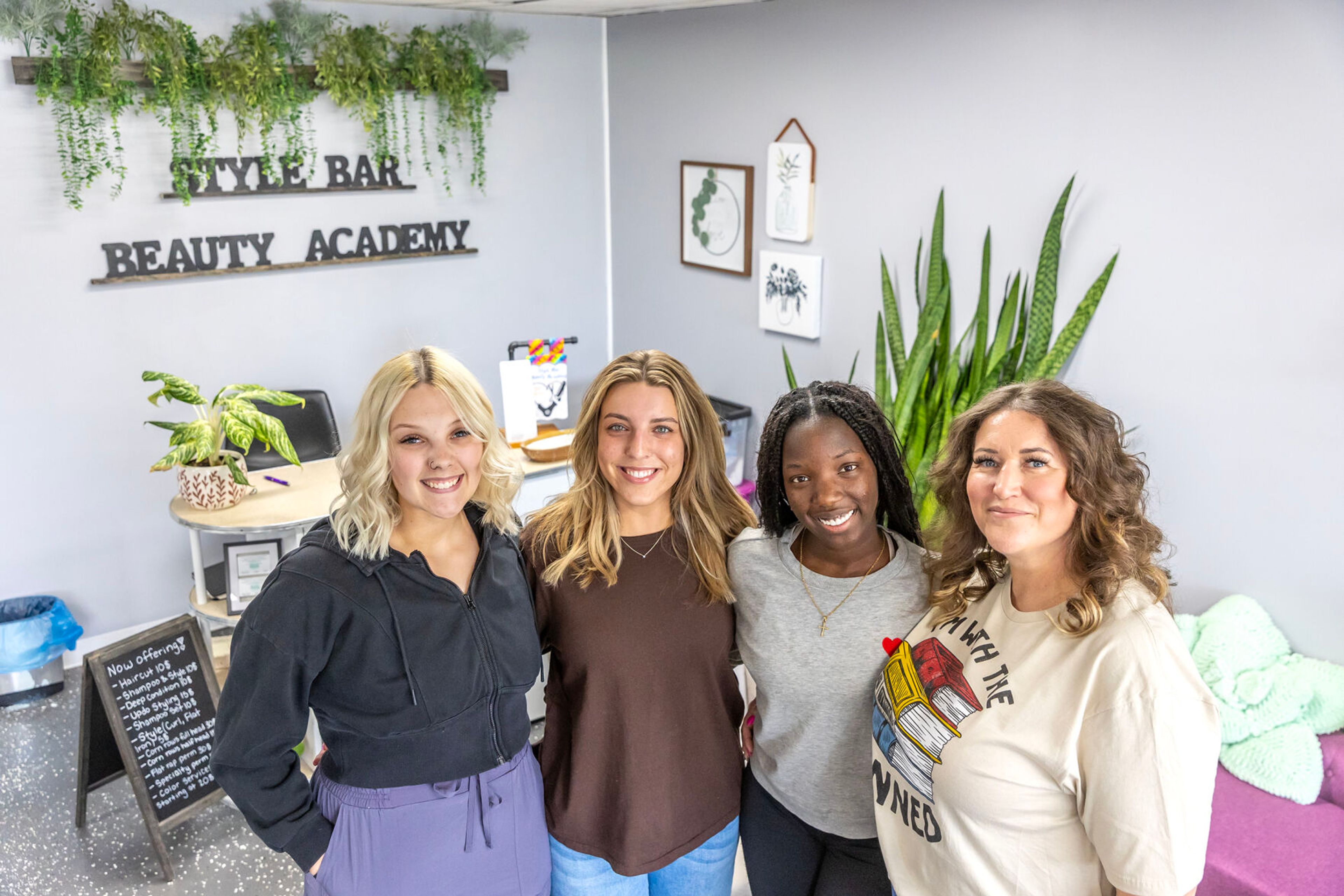 Halle Kincaid, from left, Saryn Elliot, Maureen Meyer, and Anna Estrada pose for a photo at Style Bar Beauty Academy Wednesday in Lewiston.