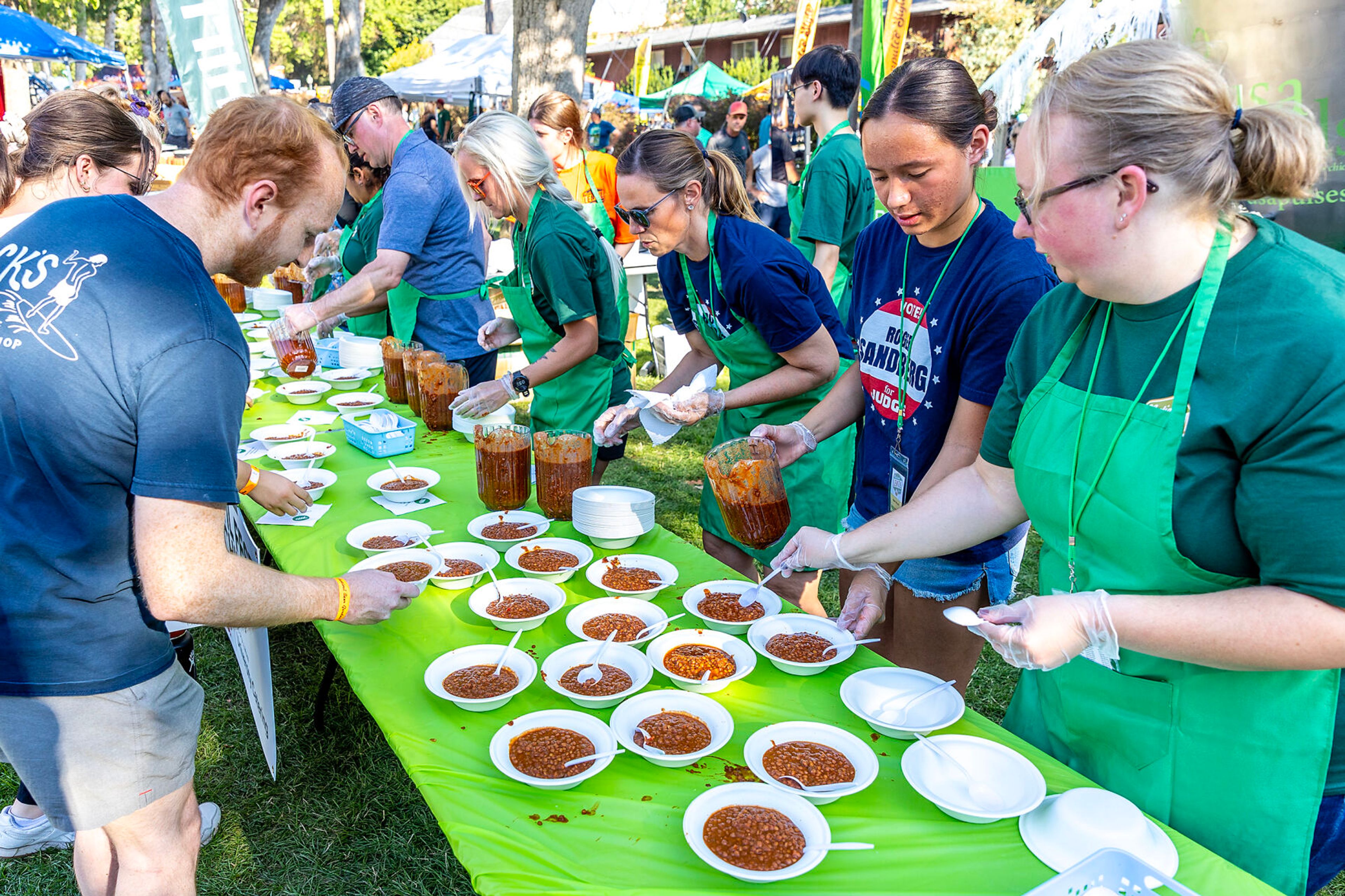 Lentil chili is served to people Saturday at Lentil fest in Reaney Park in Pullman.