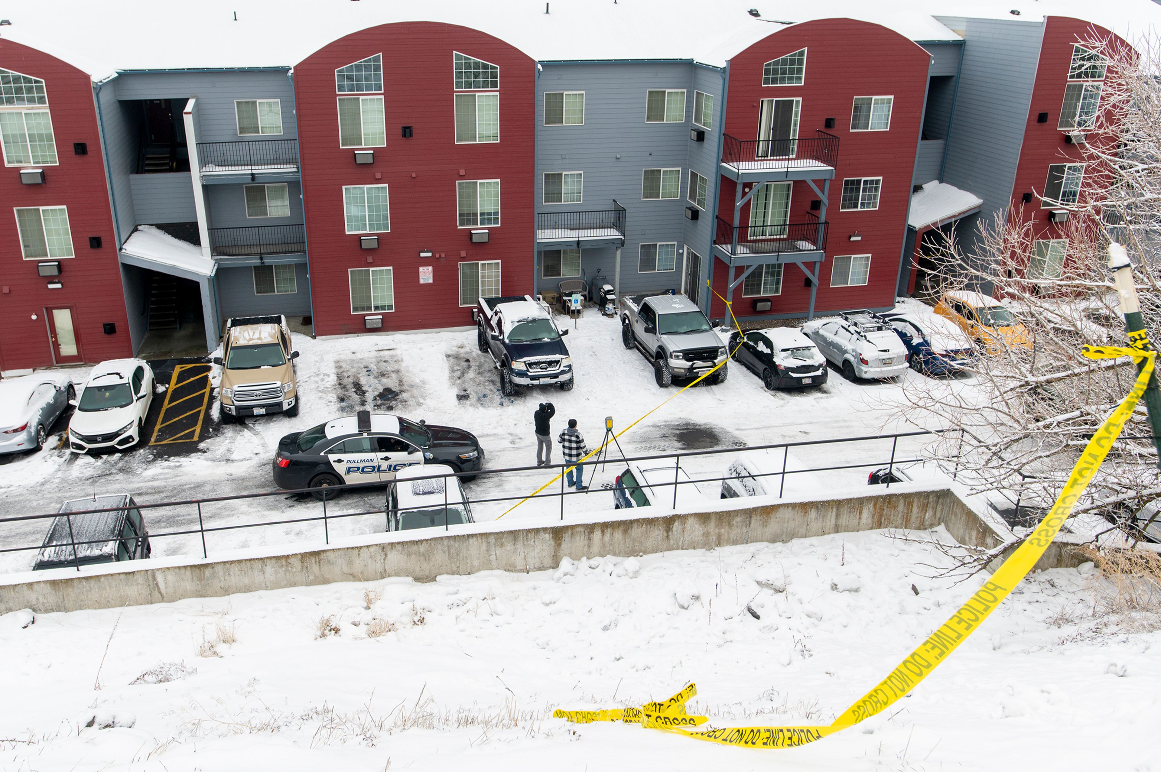 Law enforcement examines the Coffee House Apartment complex Thursday, where a member of the Whitman County Regional SWAT Team shot and killed a man in a standoff early in the morning, according to a Pullman Police Department news release.