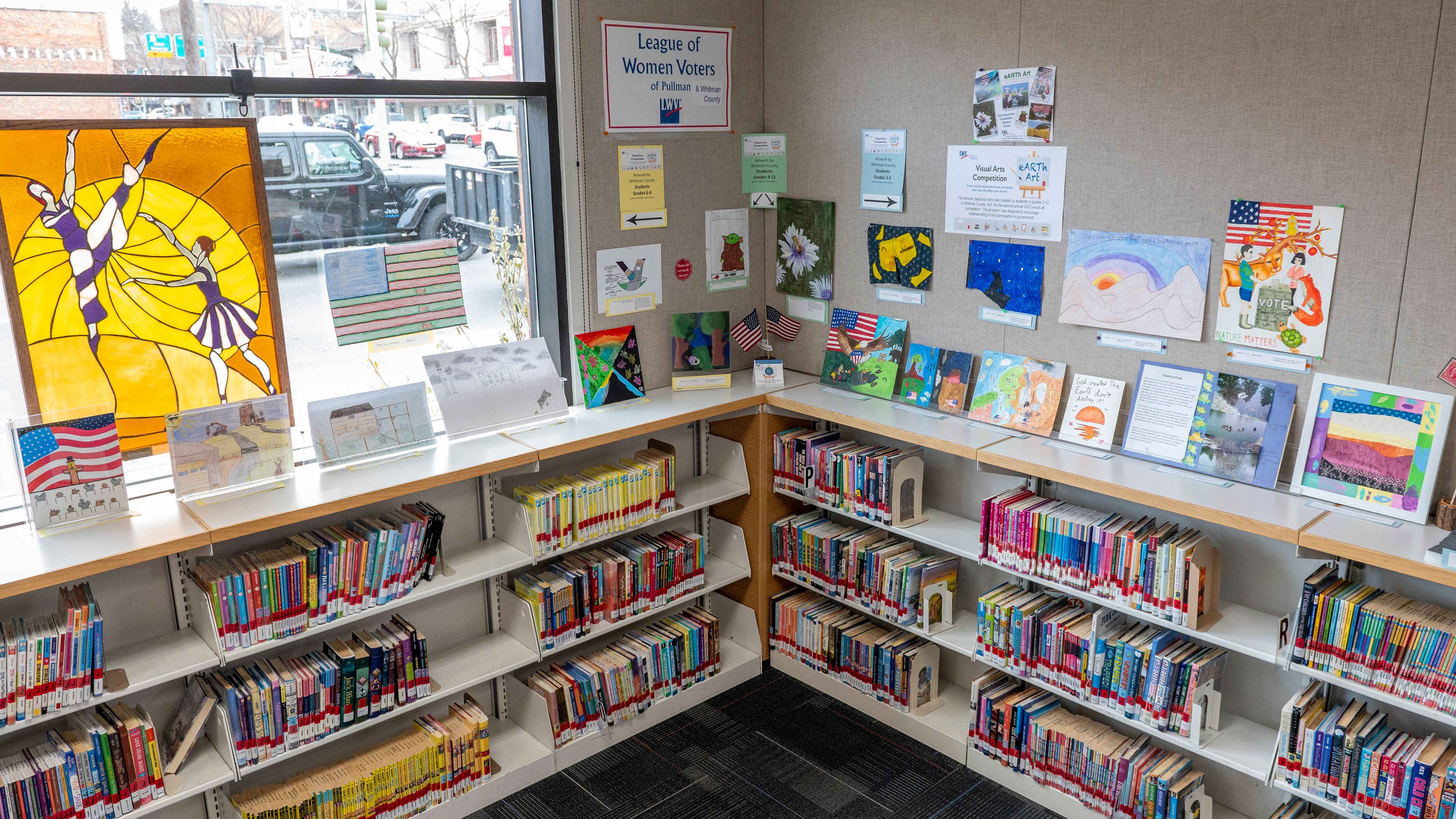 Contestants artwork are displayed from the League of Women Voters of Pullman and Whitman County’s second annual Visual Arts Competition on bookshelves at Neill Public Library in Pullman.