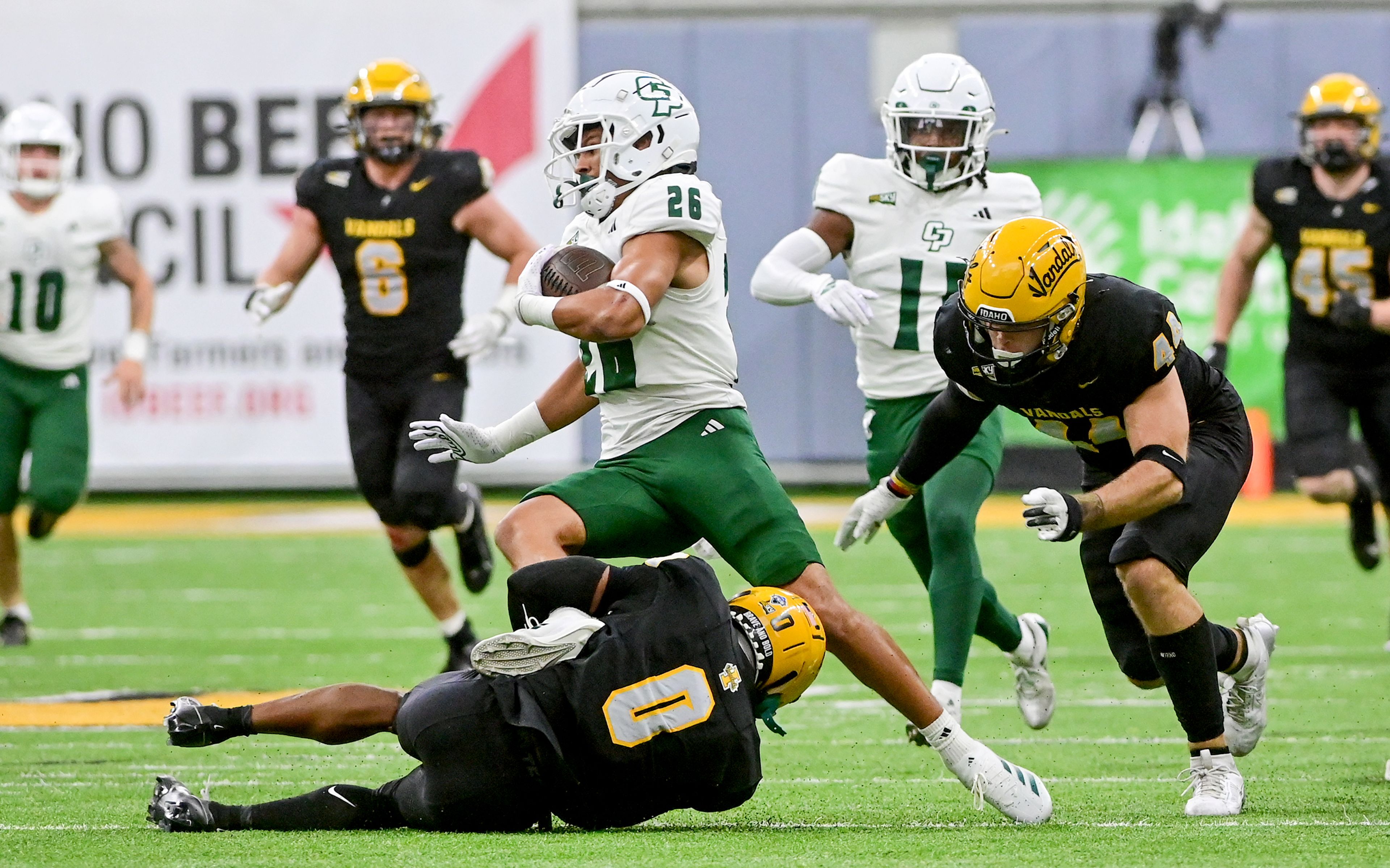 Idaho defensive back Corry Thomas Jr. grabs hold of Cal Poly running back Malachi Brown Saturday at the P1FCU Kibbie Dome in Moscow.,