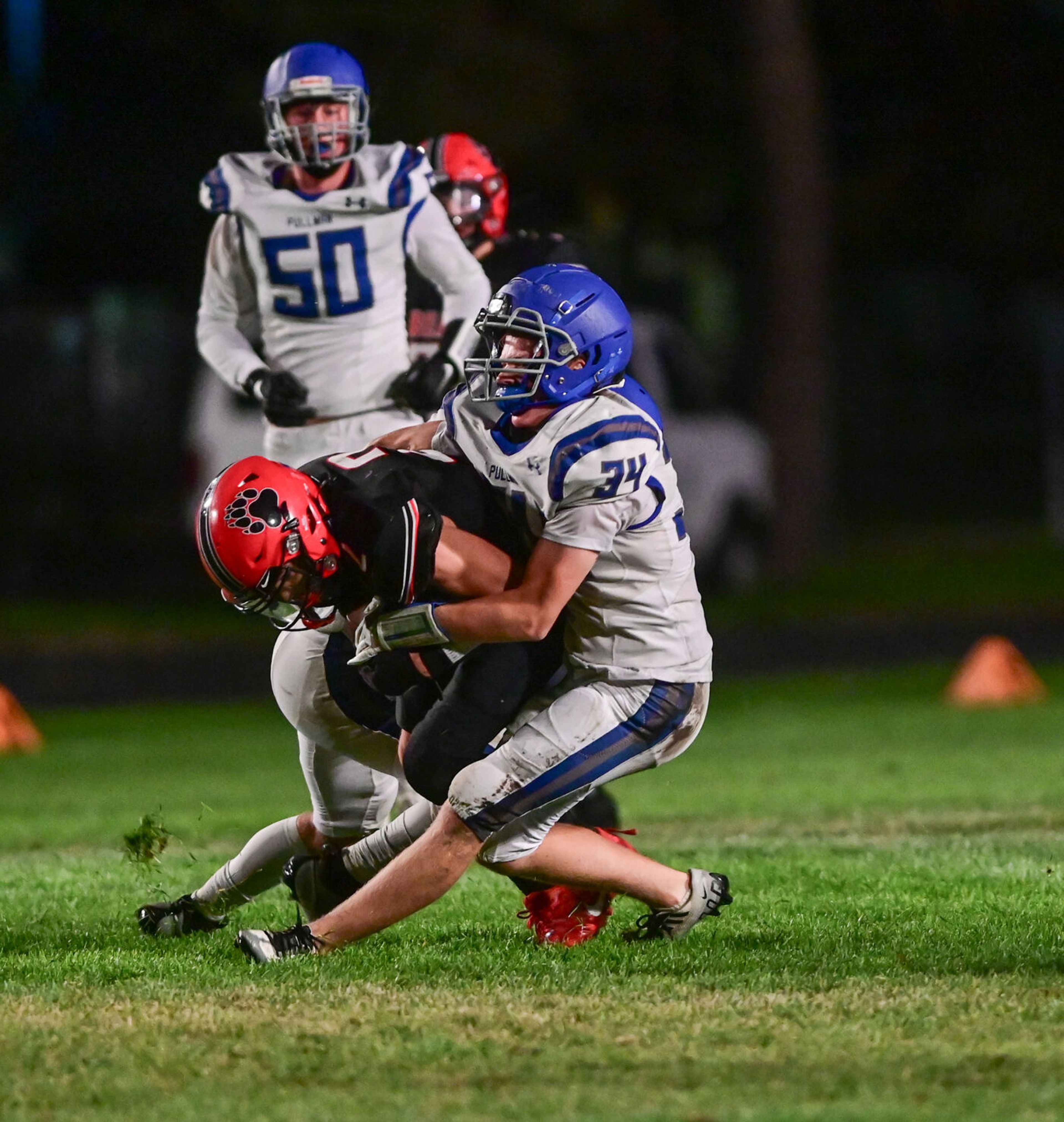 Moscow wide receiver Butch Kiblen is tackled during the final minutes of a game against Pullman Friday in Moscow.