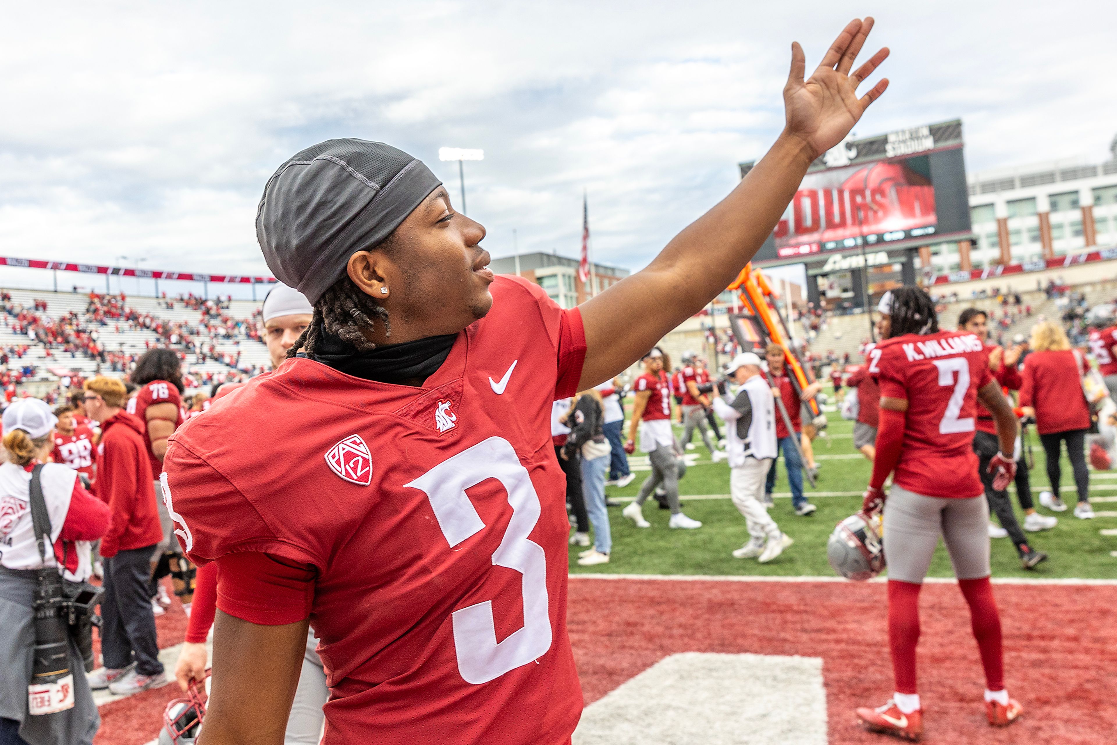 Washington State wide receiver Tre Shackelford  reacts as players head back to the locker room after defeating Hawaii in a college football game on Saturday at Gesa Field in Pullman.,