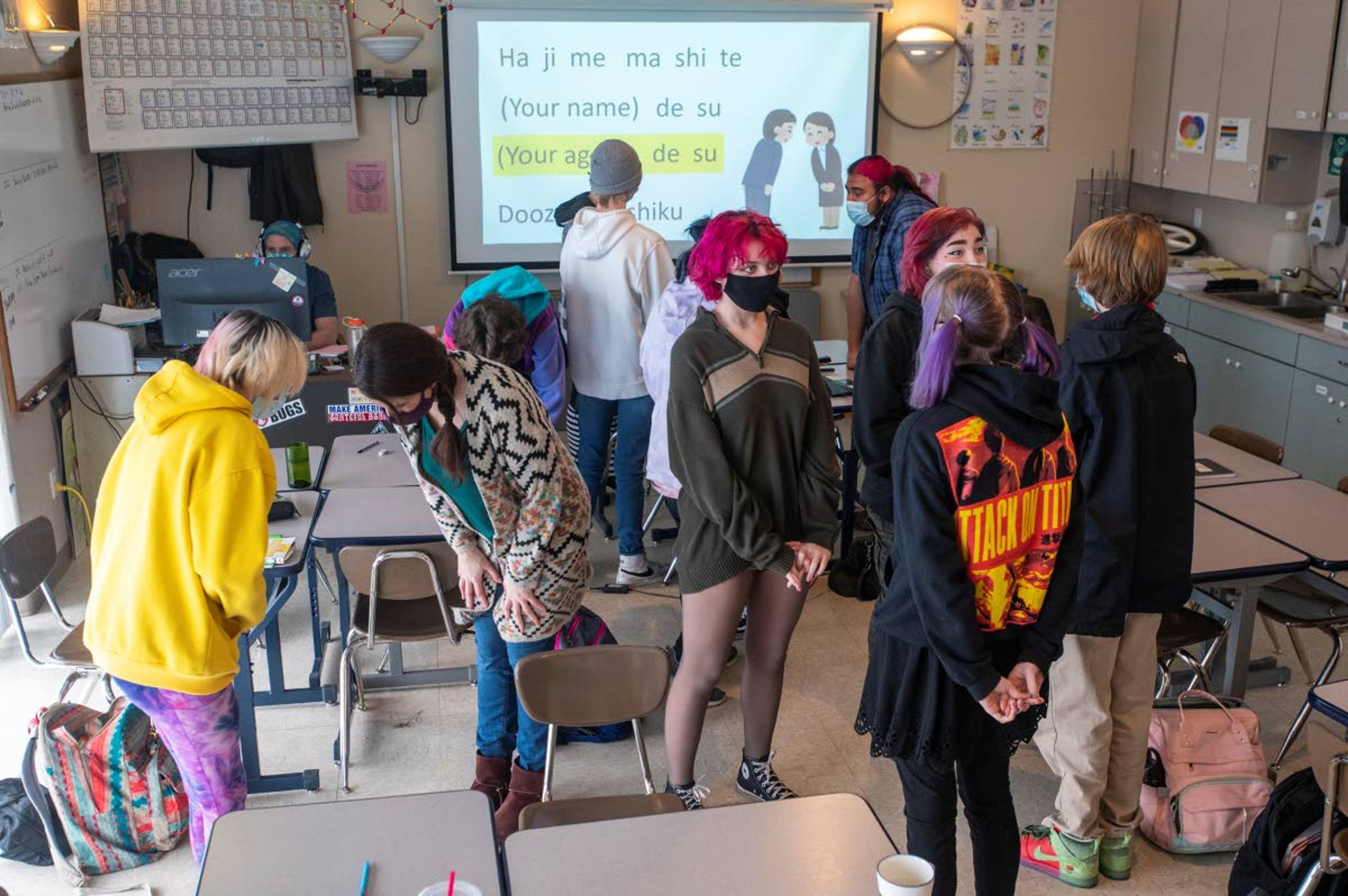 Students and faculty practice introducing themselves Wednesday using formal Japanese at Paradise Creek Regional High School in Moscow.