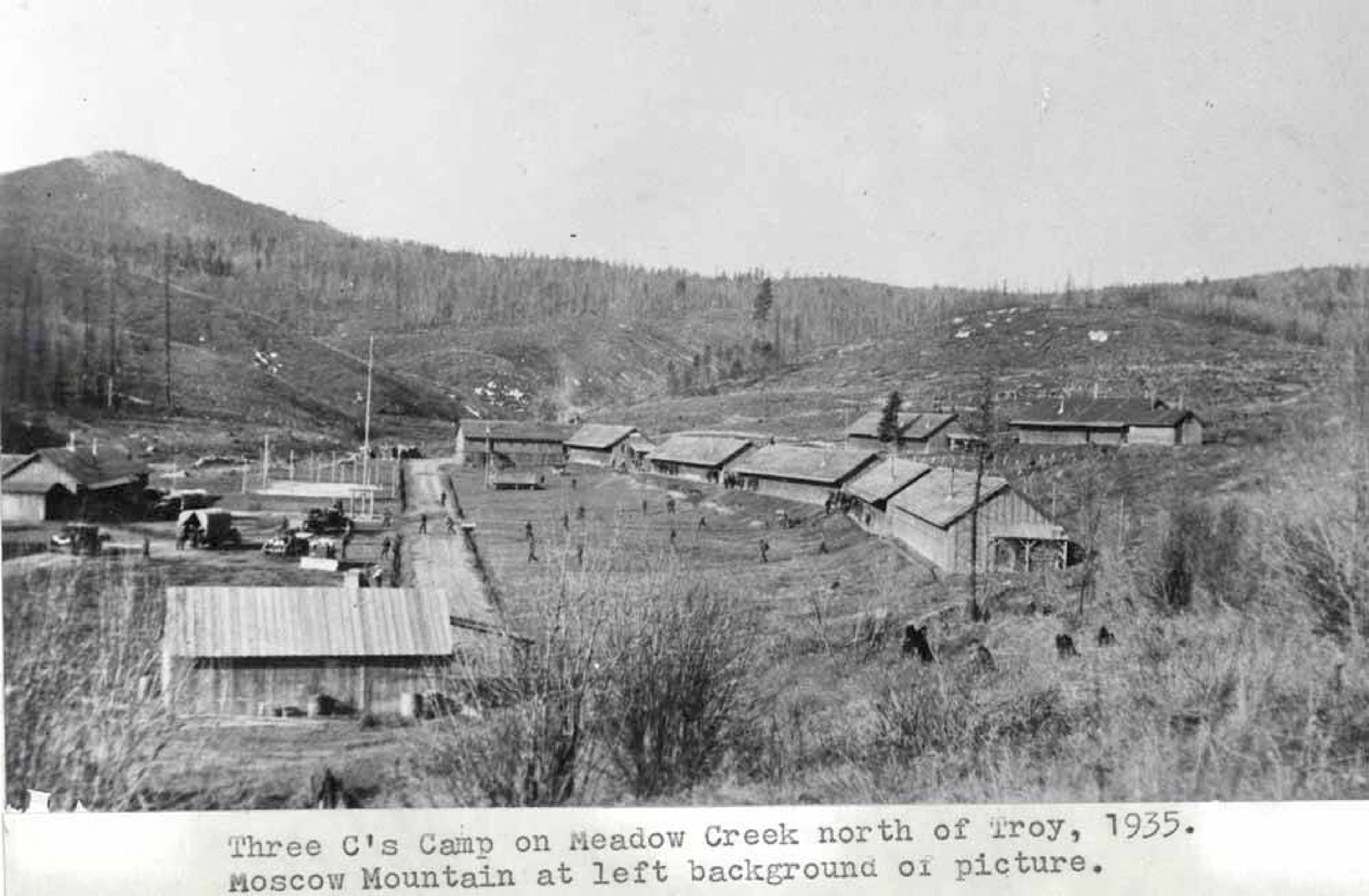 CCC Camp On Meadow Creek north of Troy in 1935. Moscow Mountain at left background of picture. Part of the Clifford M. Ott collection at the UI Library Special Collections and Archives.