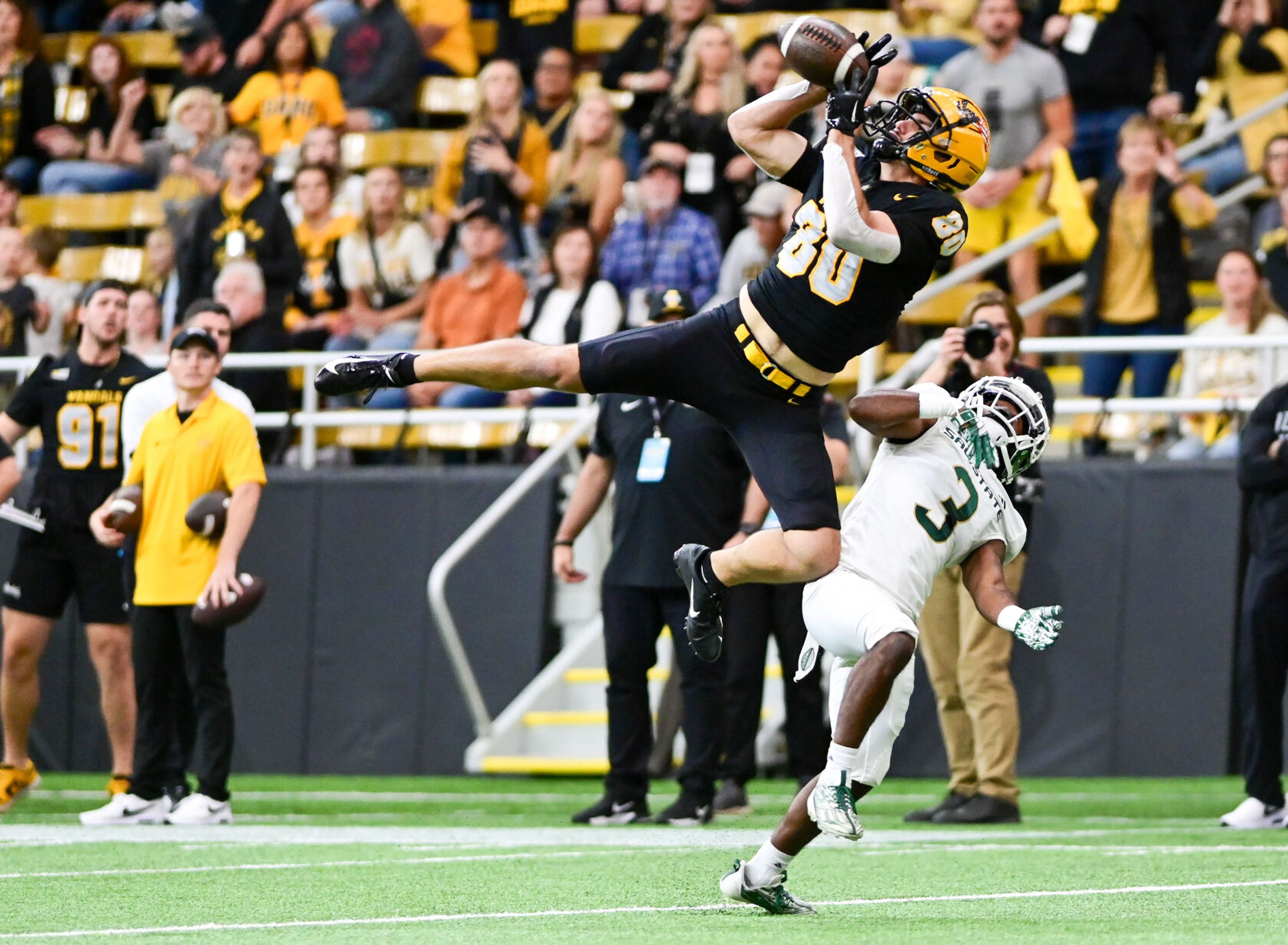 Idaho wide receiver Hayden Hatten (80) catches a pass in midair as the Vandals play Sacramento State on Sept. 23 at the P1FCU Kibbie Dome in Moscow.