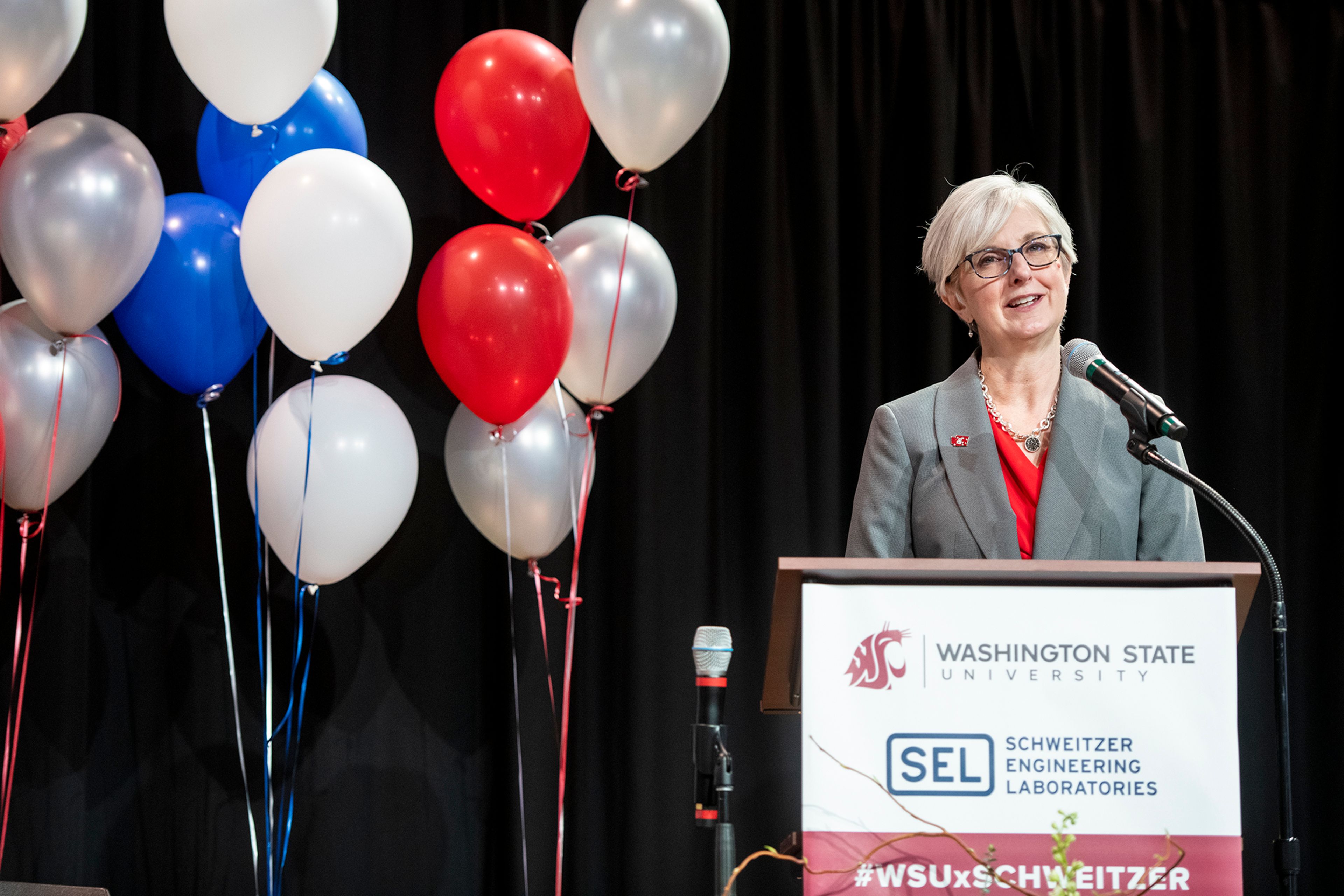 Elizabeth Chilton, provost and executive vice president of Washington State University, speaks to the audience about the long-standing relationship of Schweitzer Engineering Laboratories and WSU.