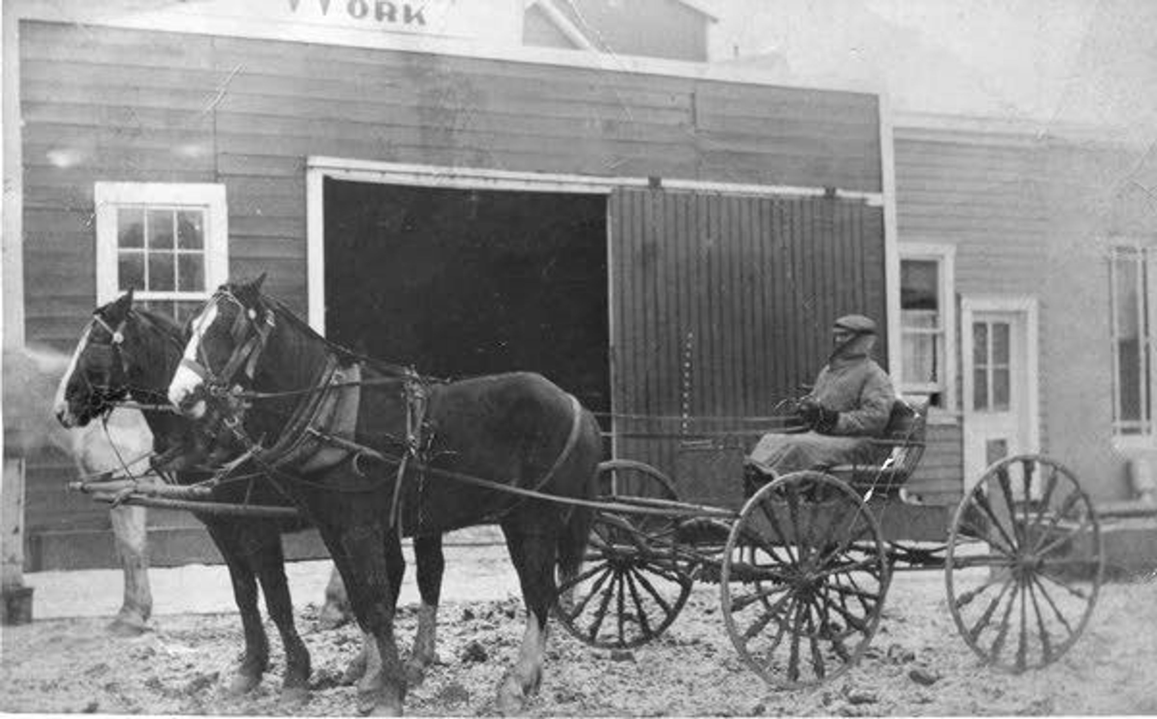 Whitman County Historical SocietyWilliam H. Tapp, one of the first three rural mail carriers for the Pullman area, is shown in this 1902 photo in front of one of Pullman’s livery stables. Tapp’s 25-mile route led up Union Flat Creek, over the hills to Chambers and Busby, and back to Pullman. When the roads were bad, the trip took two days and required an overnight stop along the route.