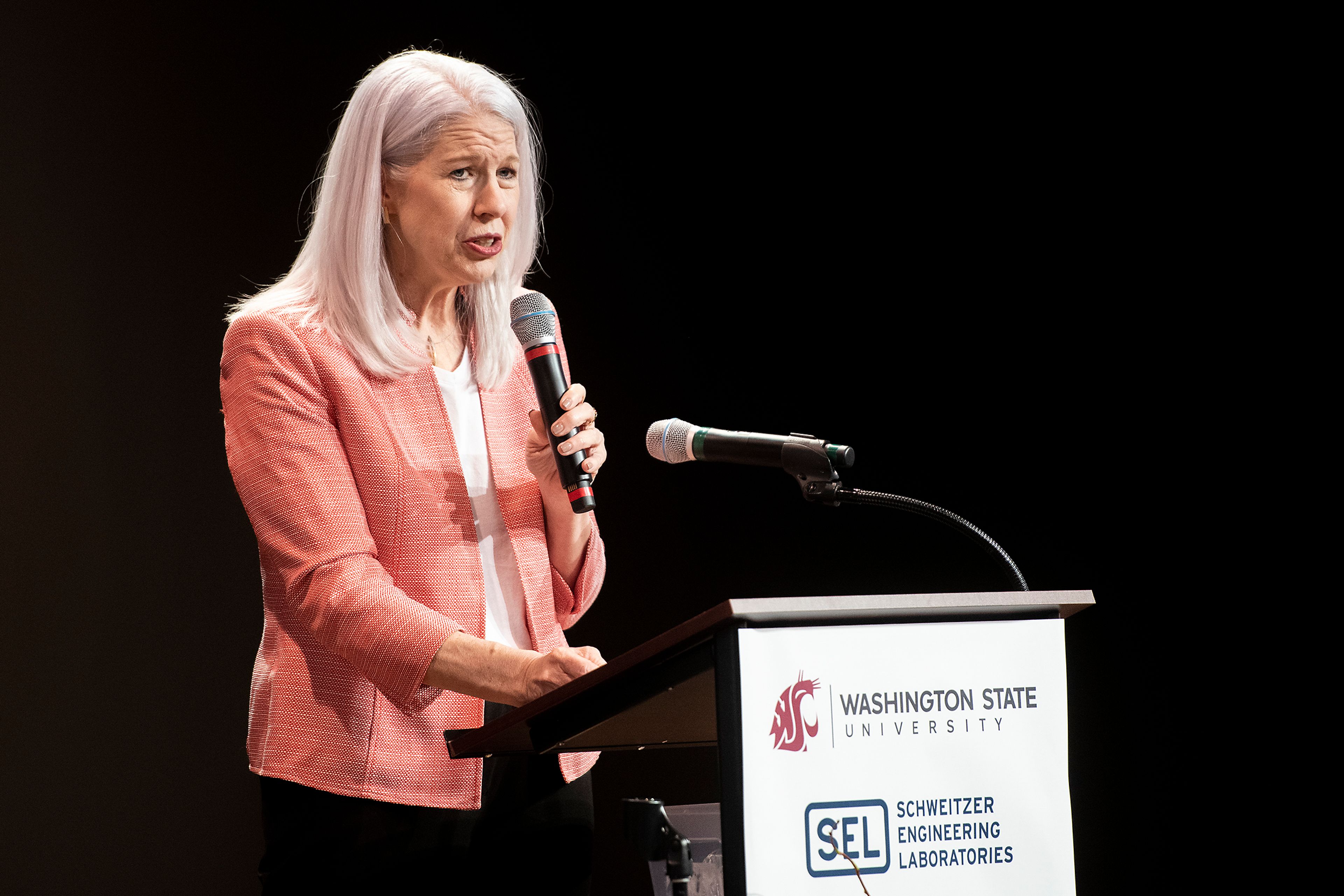 Washington State University Voiland College of Engineering and Architecture Dean Mary Rezac speaks to an audience about the long-standing relationship of Schweitzer Engineering Laboratories and WSU.