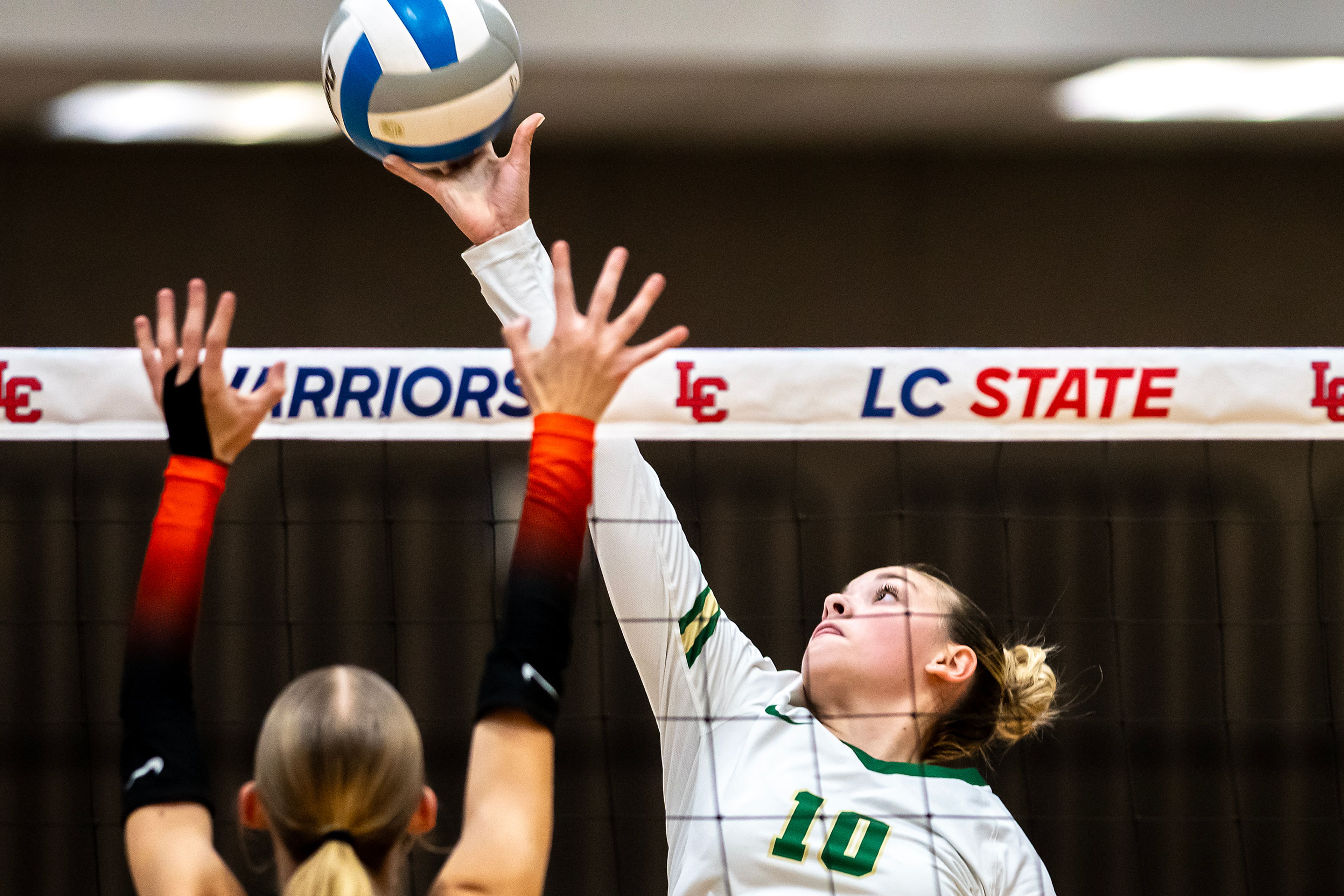 Potlatch middle blocker Brooklyn Mitchell spikes the ball against Troy during a 2A district championship Wednesday at the P1FCU Activity Center in Lewiston.