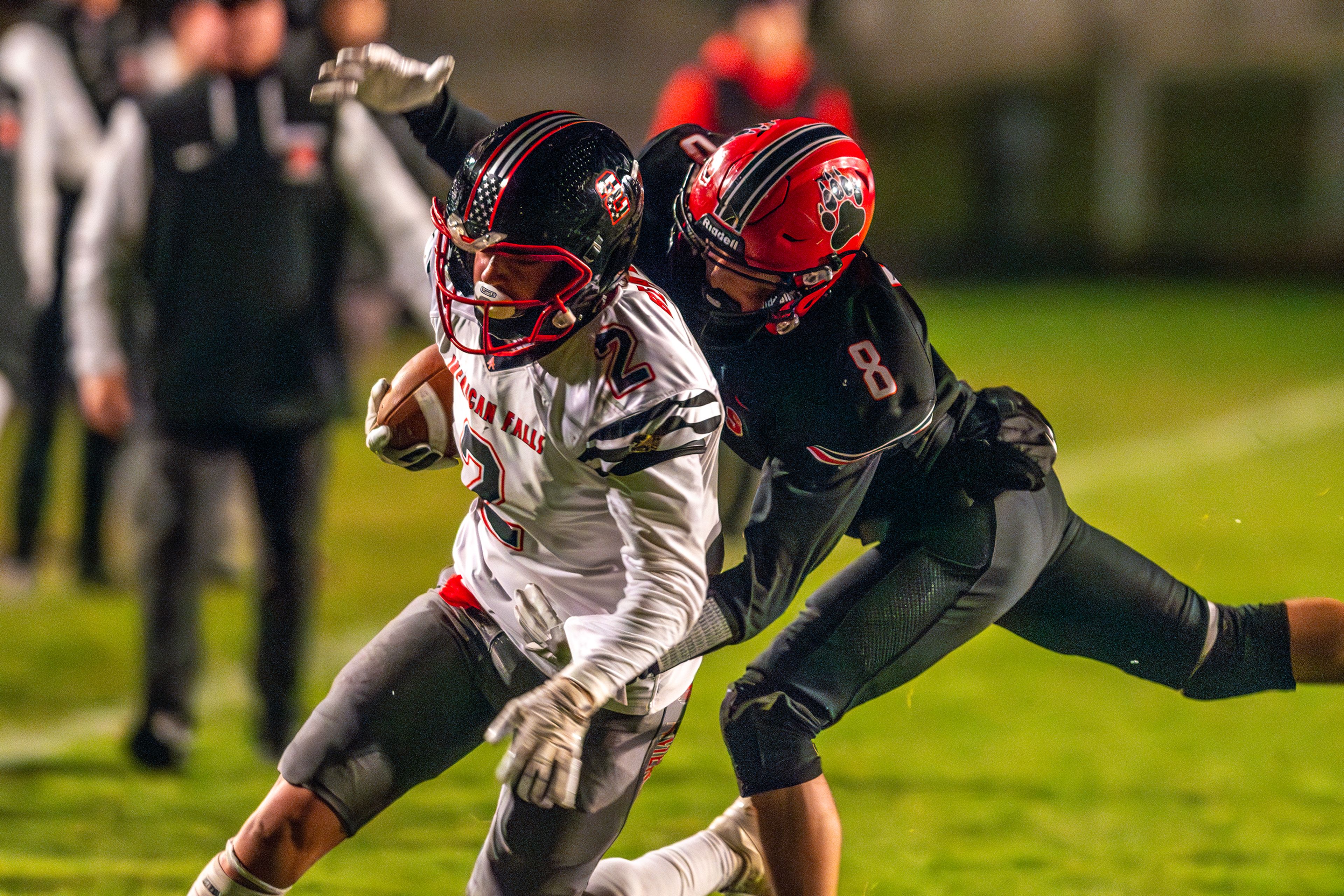 Moscow defensive back Aidan Prakash tackles American Falls' Austin Adair during an Idaho 4A playoff game Friday in Moscow.