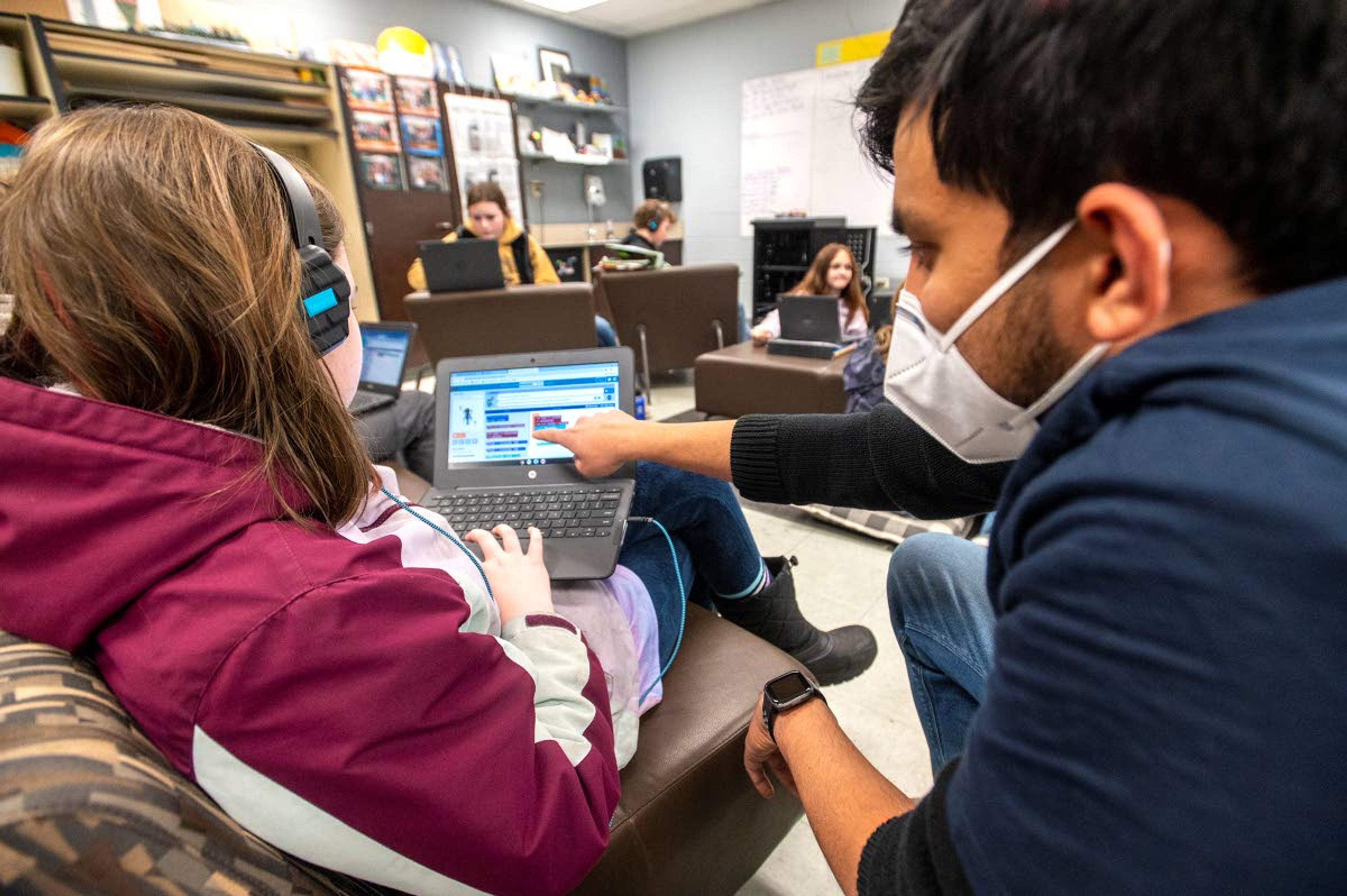 Siddarth Singh, right, of SEL, helps Shaylynn Livingston as they practice coding at Potlatch Elementary on Friday afternoon.