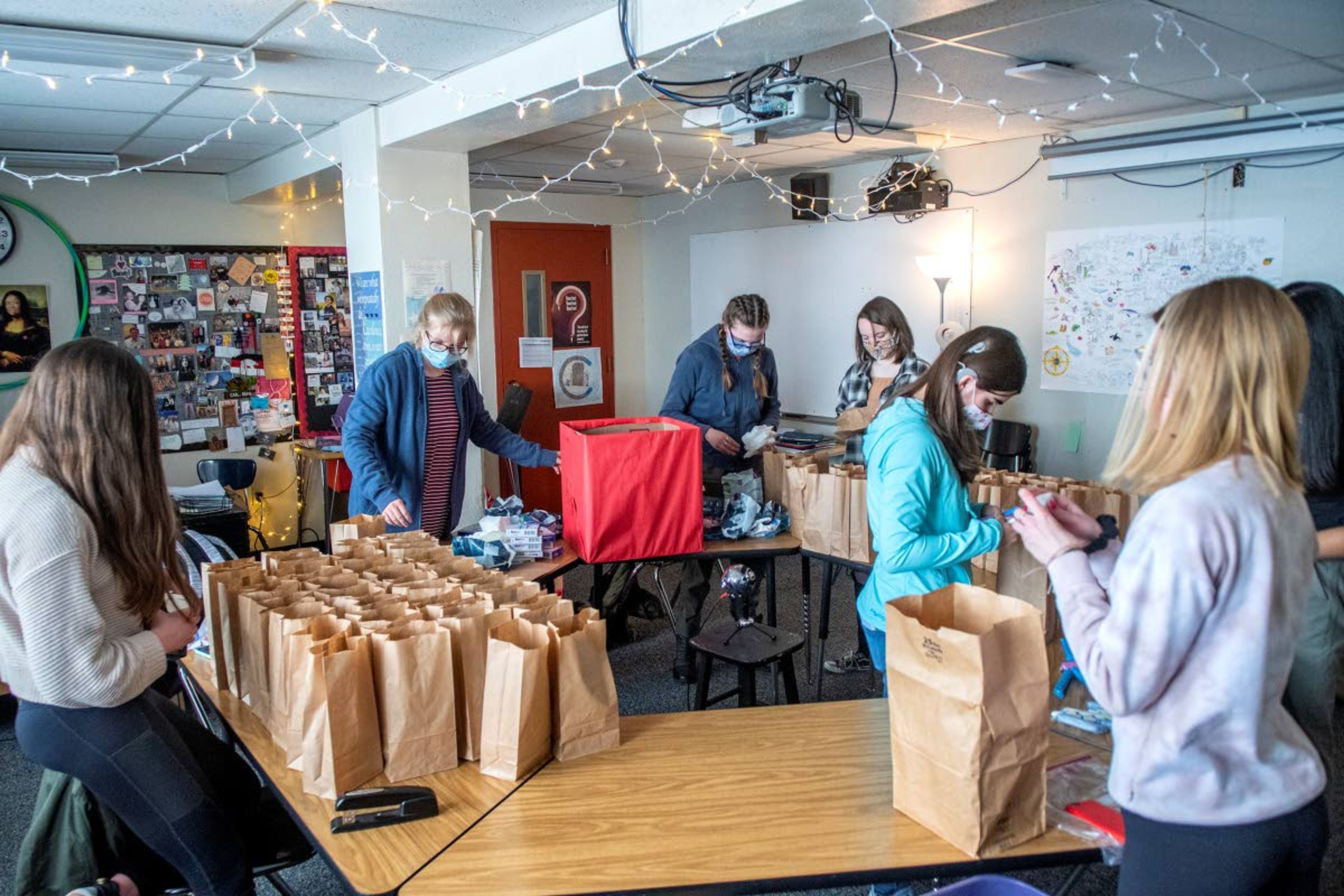 Zach Wilkinson/Daily NewsMembers of “PERIOD: The Menstrual Movement,” package period product supplies Feb. 10 at Moscow High School. The supplies were donated to Family Promise of the Palouse and Alternatives to Violence of the Palouse.