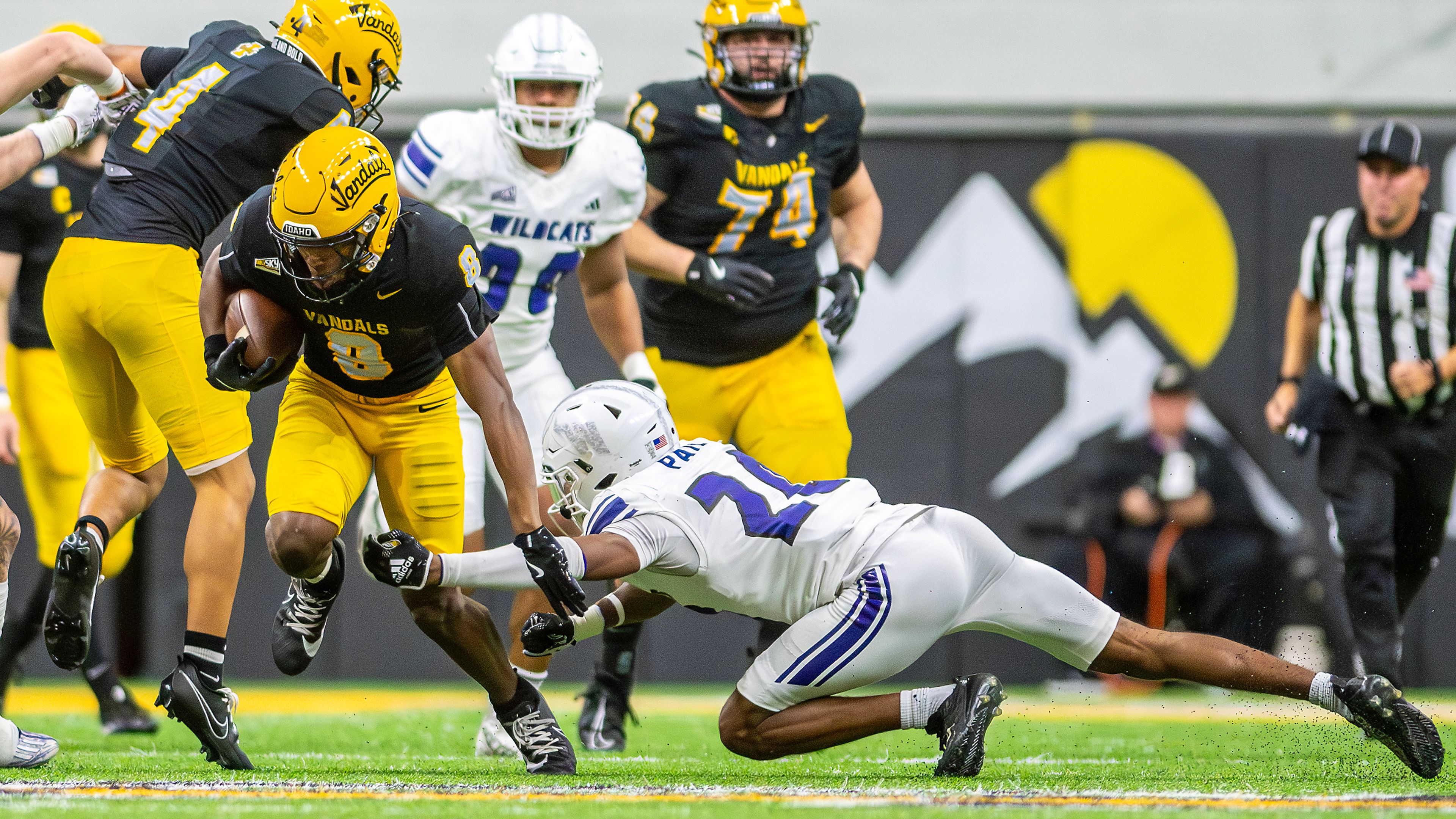 Idaho running back Deshaun Buchanan avoids a tackle from Weber State cornerback Montae Pate during a quarter of a Big Sky conference game Saturday at the P1FCU Kibbie Dome in Moscow.