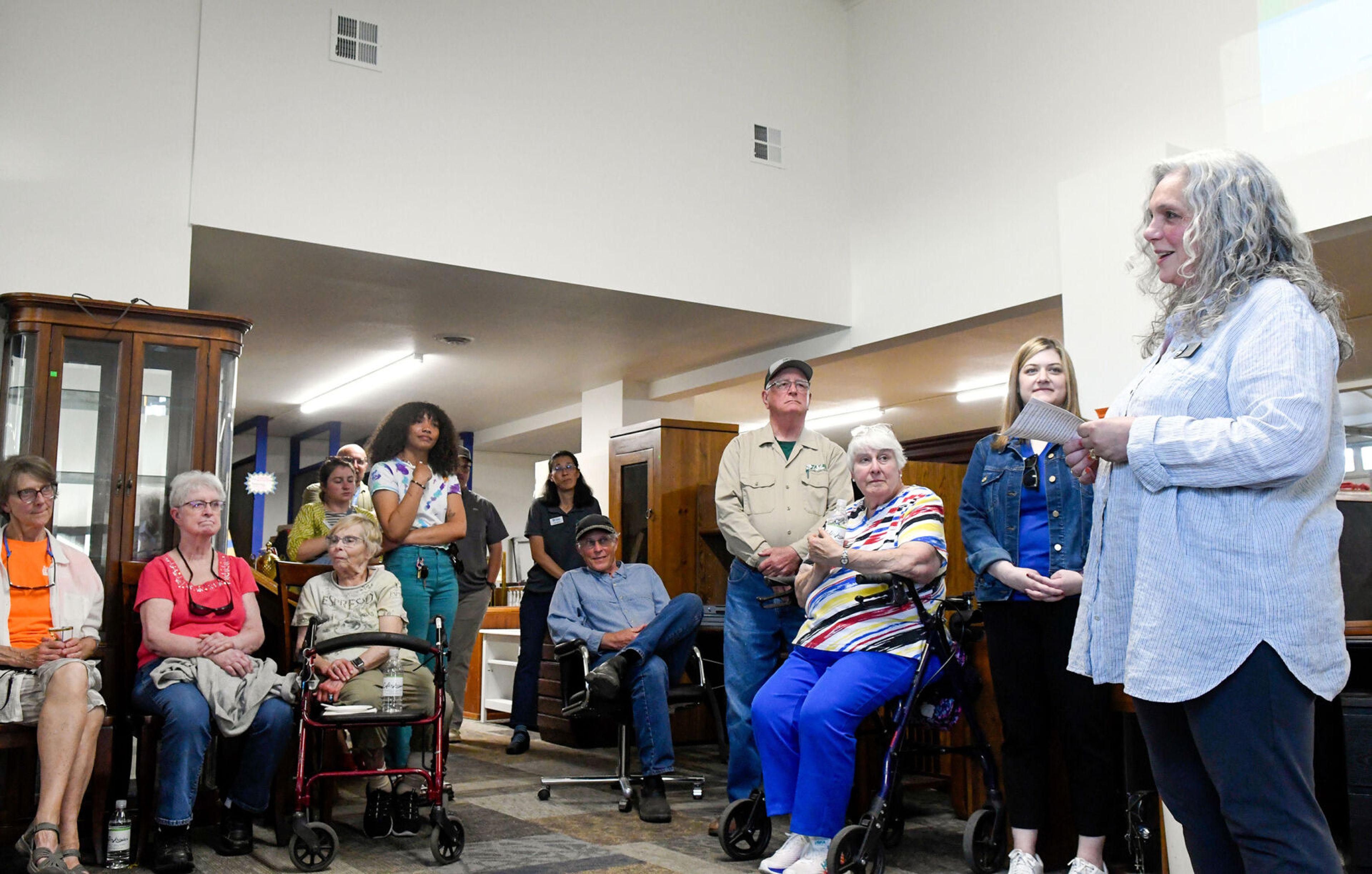 Gina Taruscio, right, city of Moscow City Council member, speaks at the grand reopening celebration for the Palouse Habitat for Humanity ReStore in Moscow on Thursday.