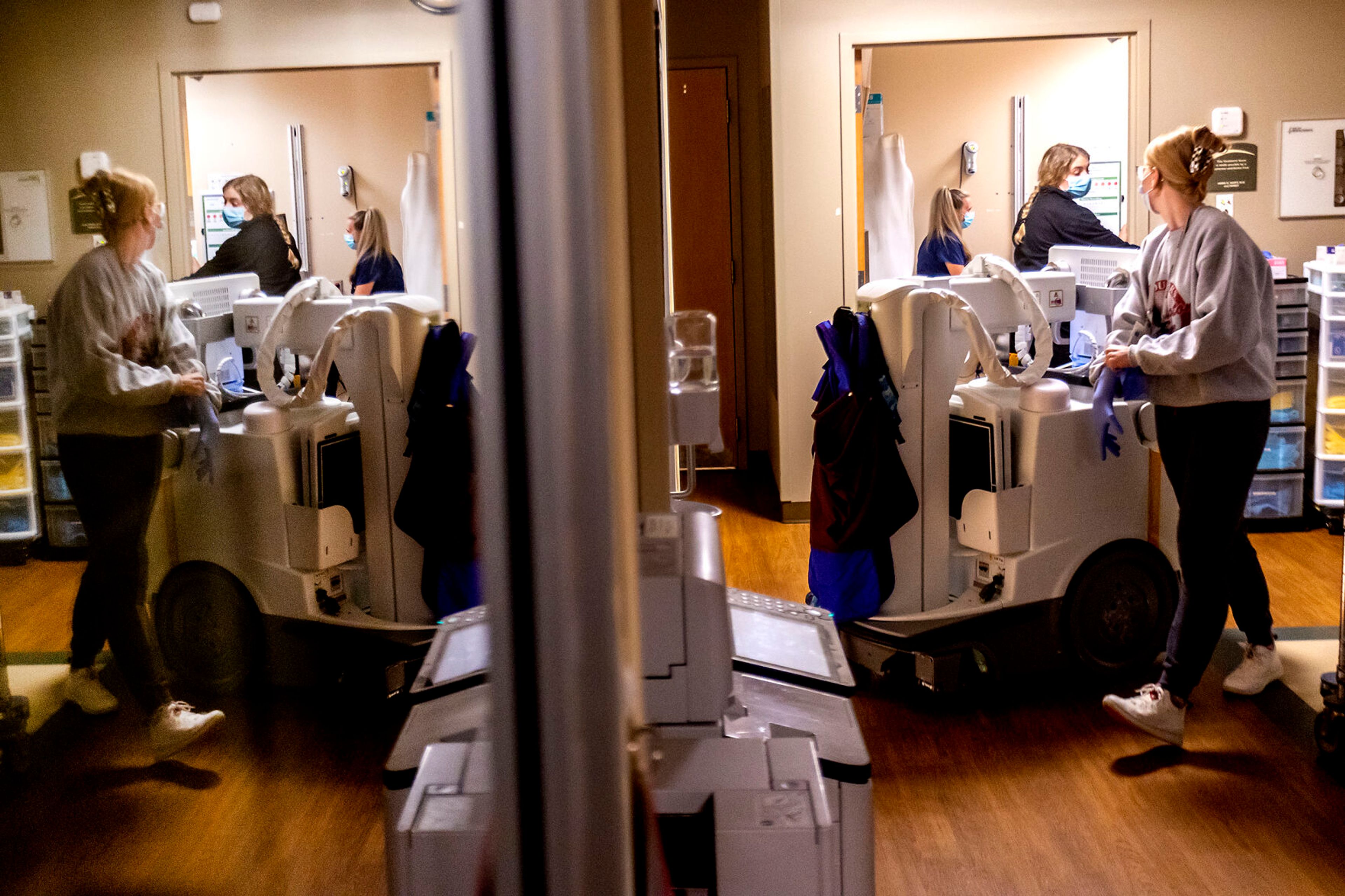 Hospital staff move about in and out of patients rooms at the Pullman Regional Hospital emergency room Sept. 24.