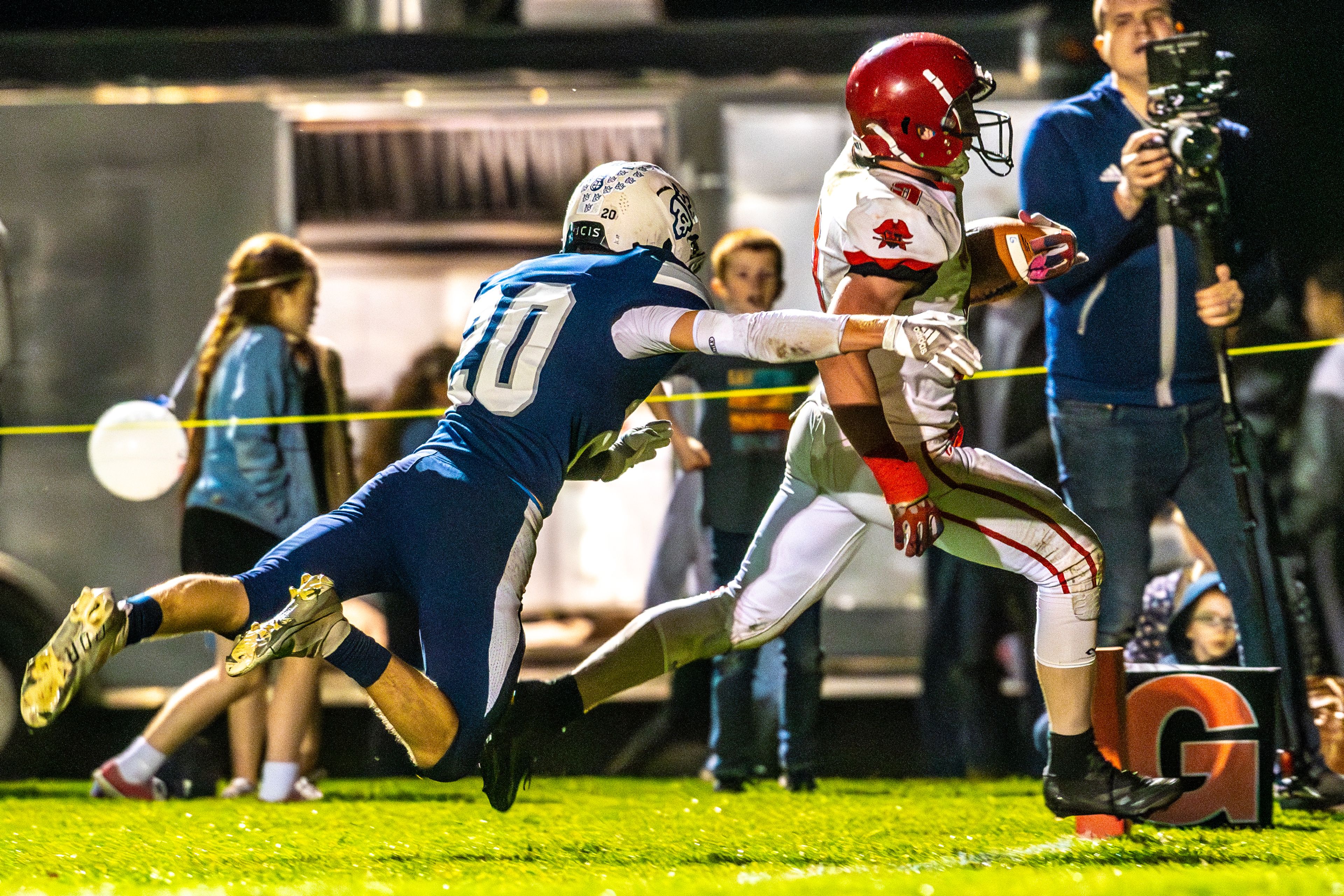 Prairie Dylan Uhlenkott runs in for a touchdown as Logos Honour Mallery tries to stop him during a conference game Friday in Moscow.,