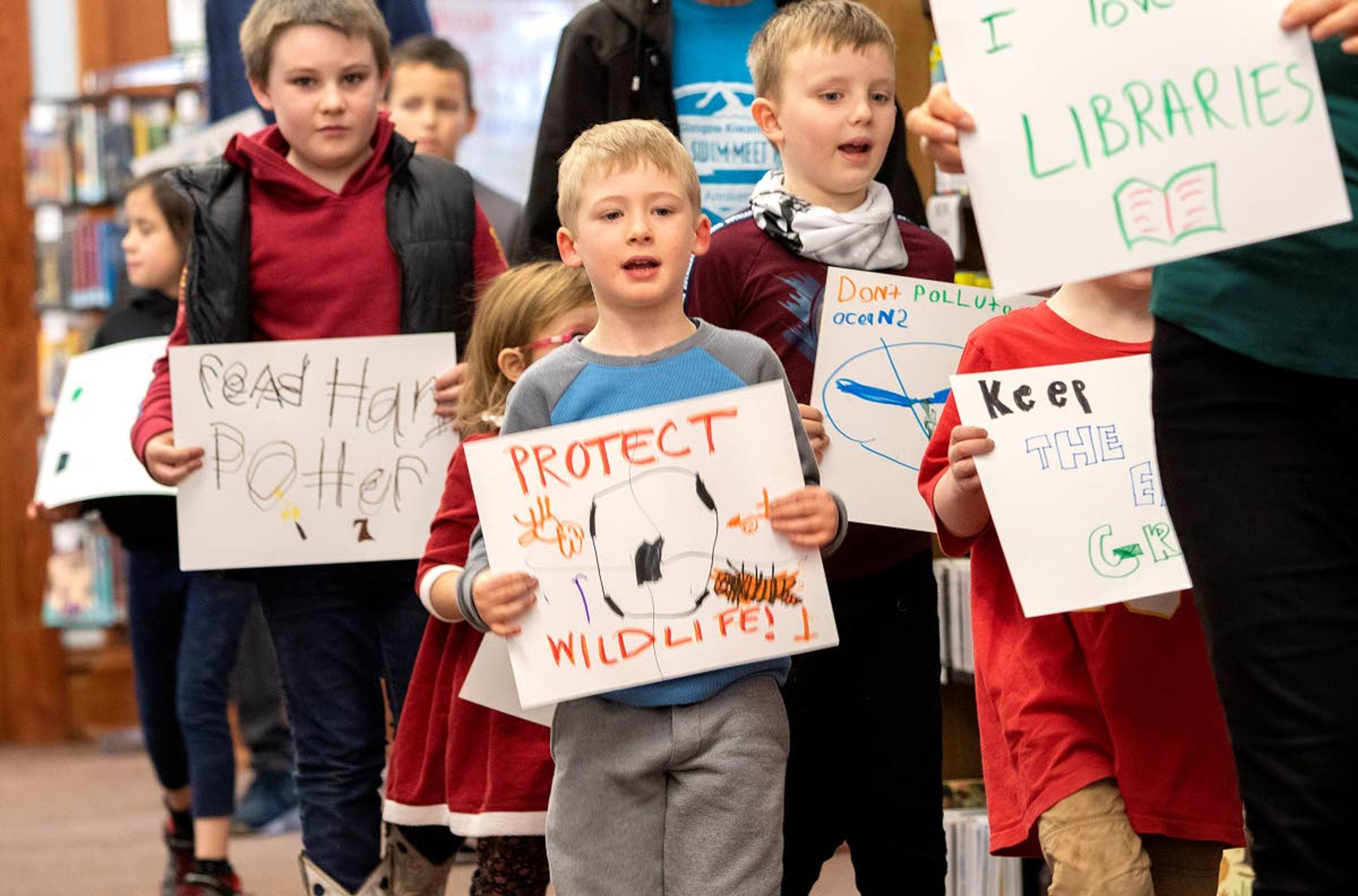 Children march in support of making our world better during “Shape The Future: A Kids Intro To Activism” on Tuesday at the Moscow Public Library. The event was led by Moscow author Annette Bay Pimentel, who also read the children books about activists. Pimentel’s children’s book “All The Way To The Top: How One Girl’s Fight For Americans With Disabilities Changed Everything” will be released next week.