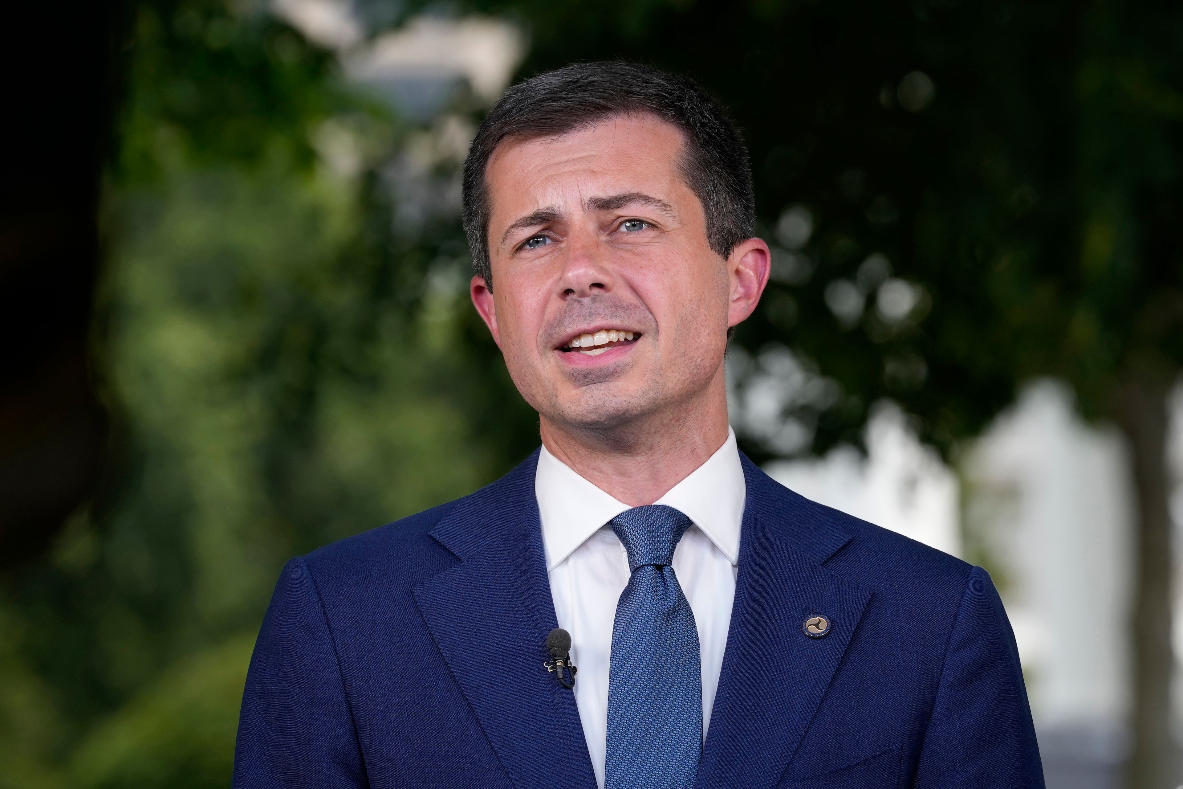 Transportation Secretary Pete Buttigieg talks with reporters at the White House in Washington on July 23, 2024.