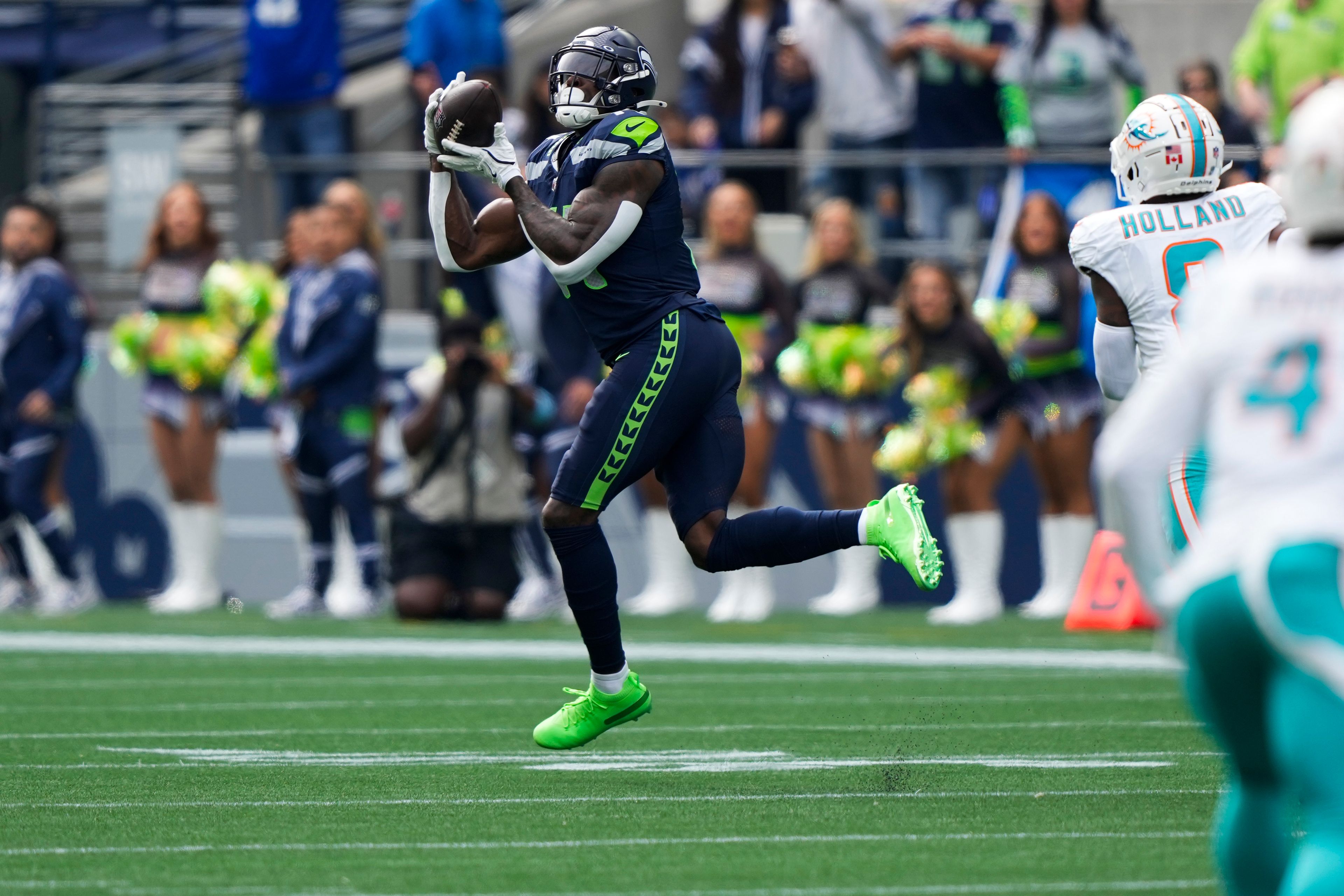 Seattle Seahawks wide receiver DK Metcalf makes a catch before running the ball for a touchdown during the first half of an NFL football game against the Miami Dolphins, Sunday, Sept. 22, 2024, in Seattle. (AP Photo/Stephen Brashear)