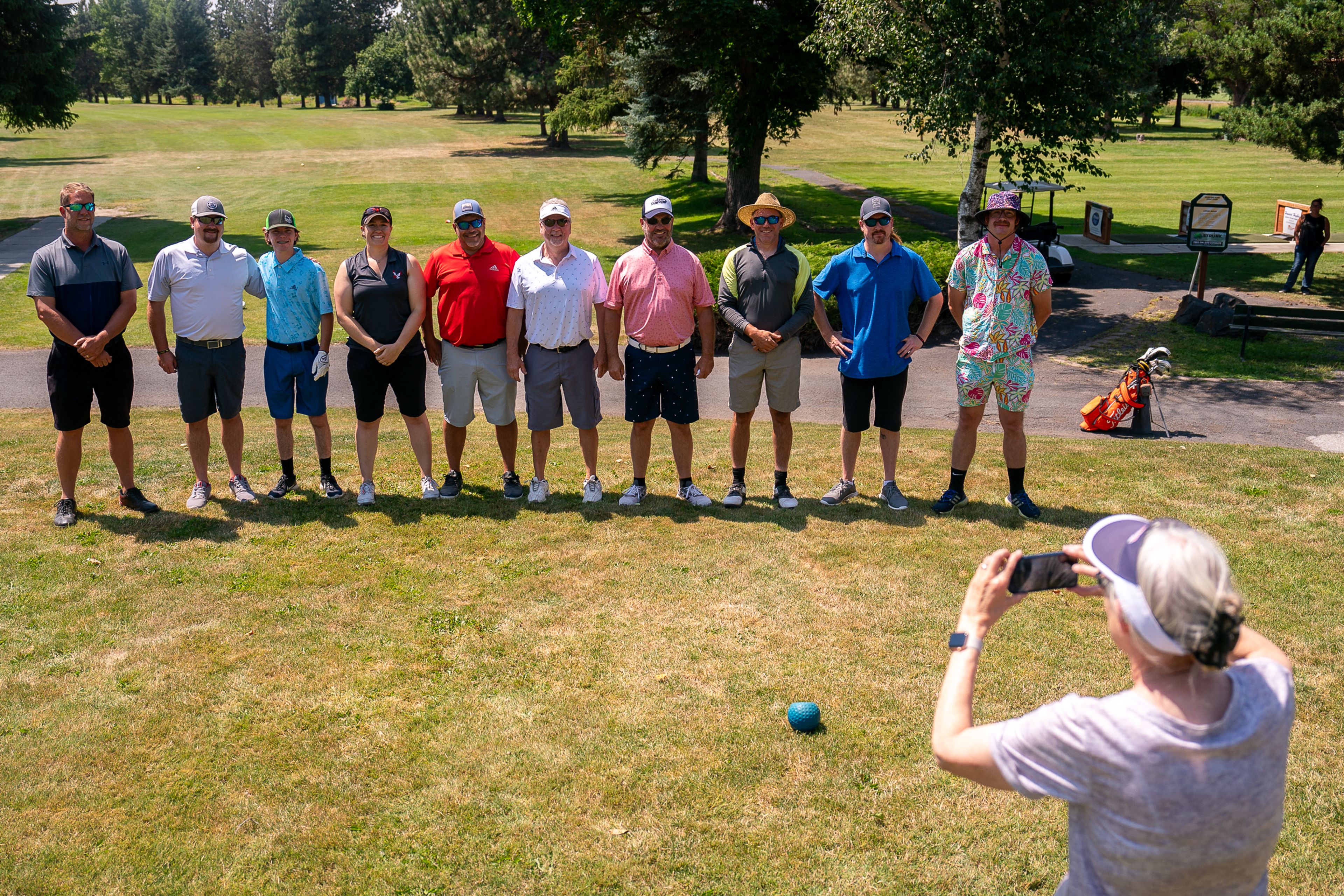 The ten participants of the 74th annual Moscow Elks Sole Survivor golf tournament pose for a photo taken by Kathy Christian, right, before the event on Tuesday.