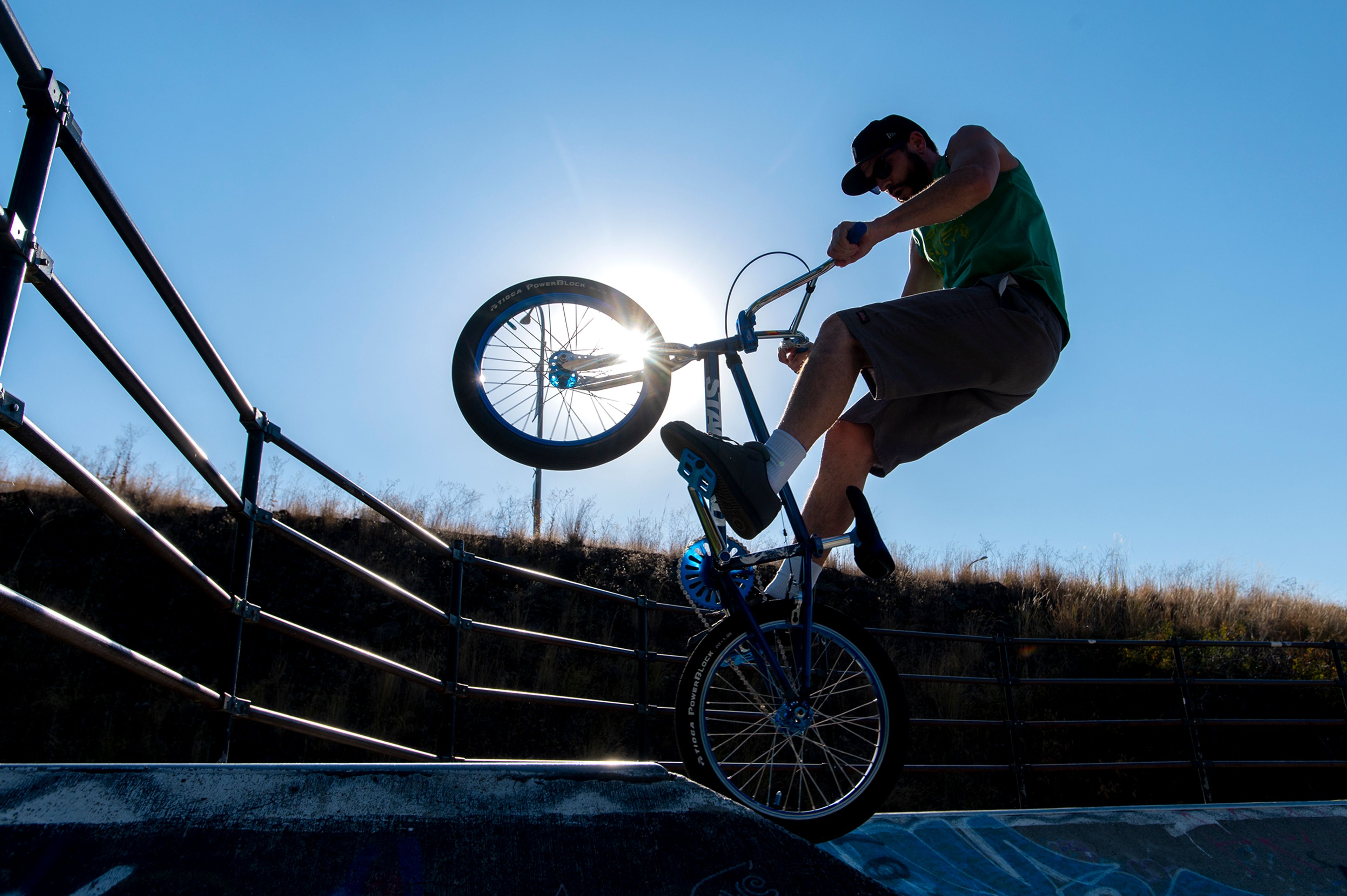 Joe Filippi, of Port Orchard, Wash., practices tricks on his bike at the Spring Street Skate Park in Pullman on Tuesday. Filippi mentioned he wanted the community to come together to build a larger skatepark. “I would love to see something bigger here for the community. It brings people in and gets people outside,” Filippi said.