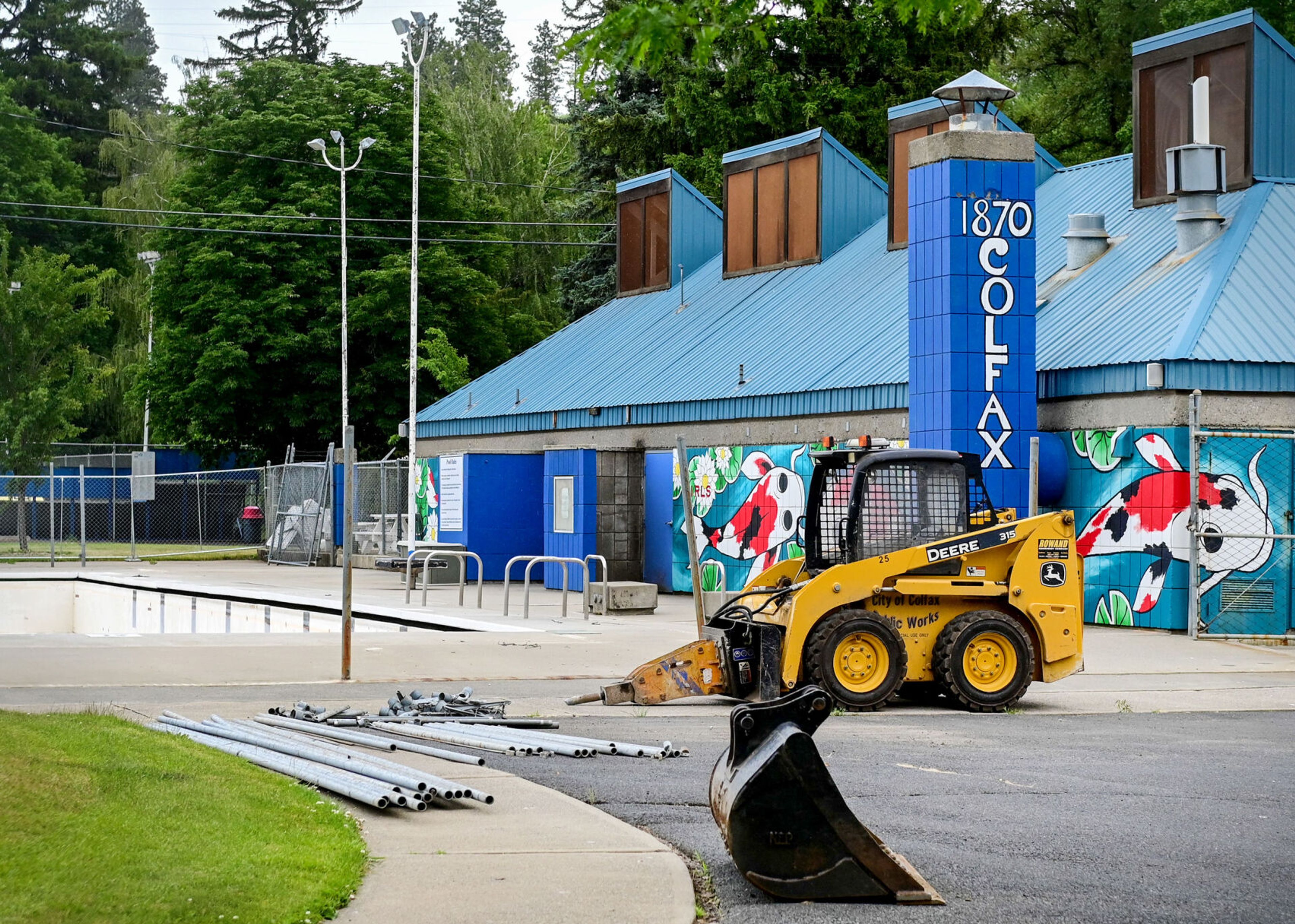 Construction equipment sits near the Colfax Municipal Pool on Monday. The facility is closed for renovations this year.