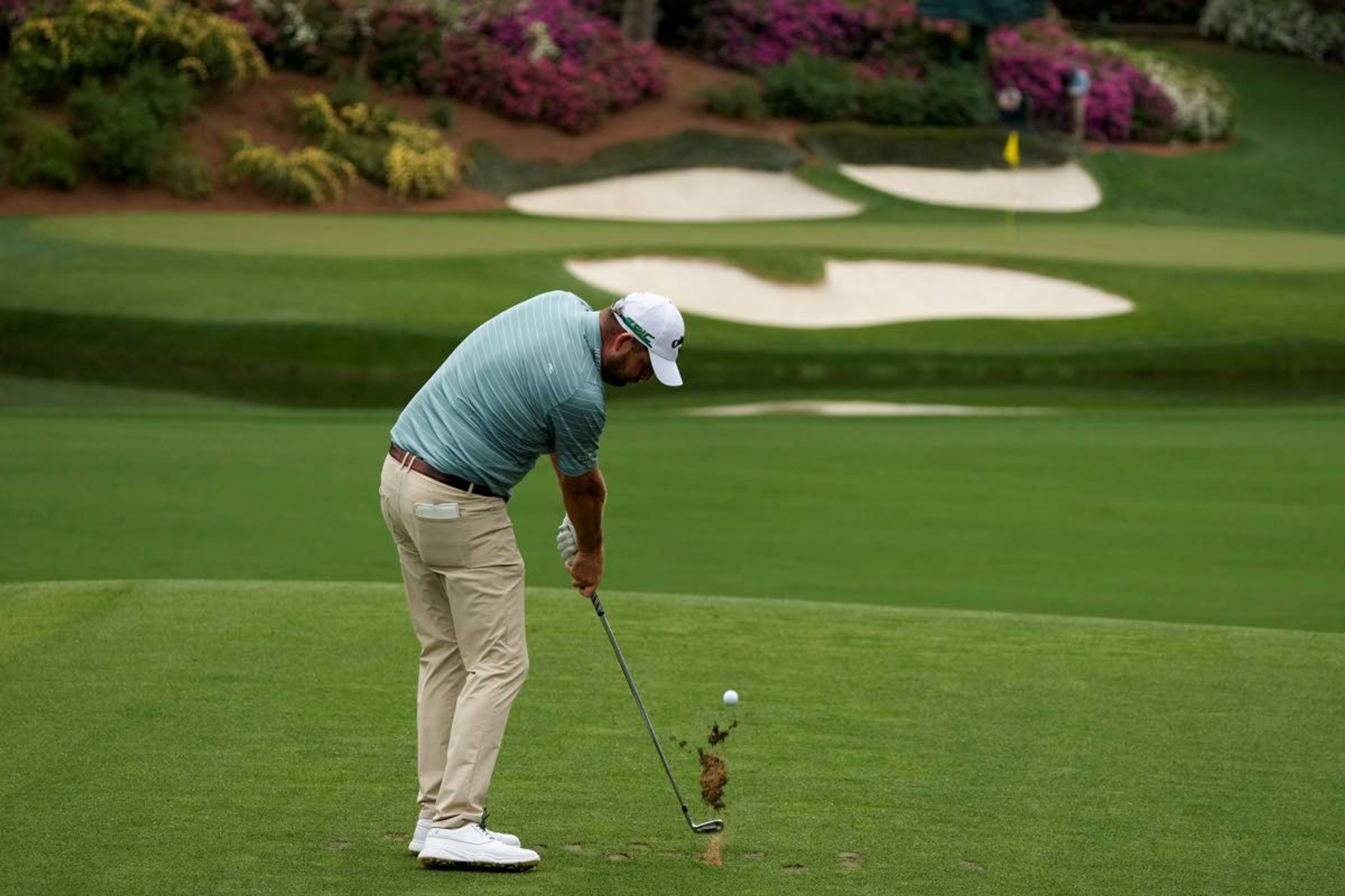 Marc Leishman, of Australia, hits his tee shot on the 12th hole during the second round of the Masters golf tournament on Friday, April 9, 2021, in Augusta, Ga. (AP Photo/Charlie Riedel)