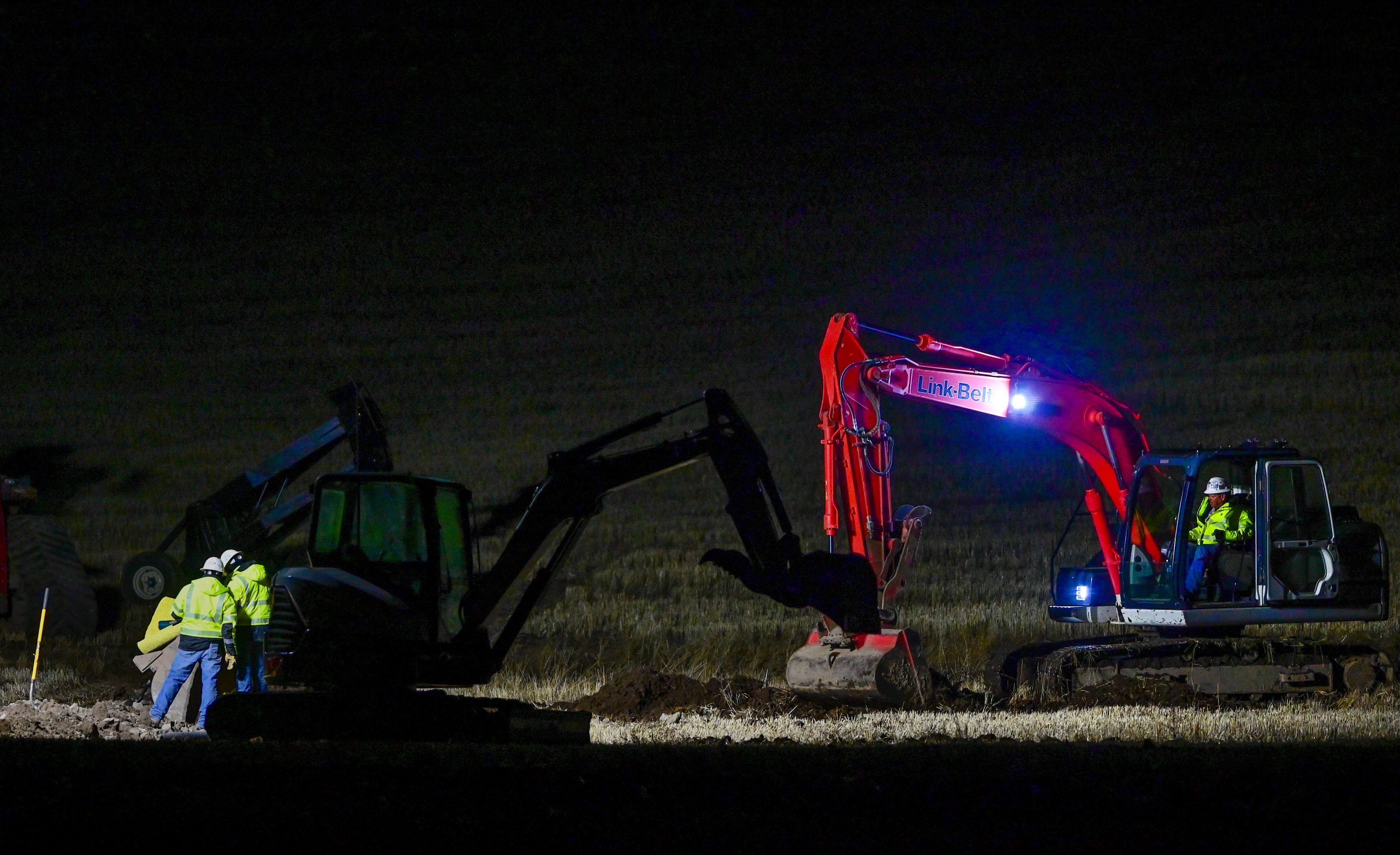 A crew works on a ruptured gas line along U.S. Highway 195 a few miles north of Pullman on Wednesday.