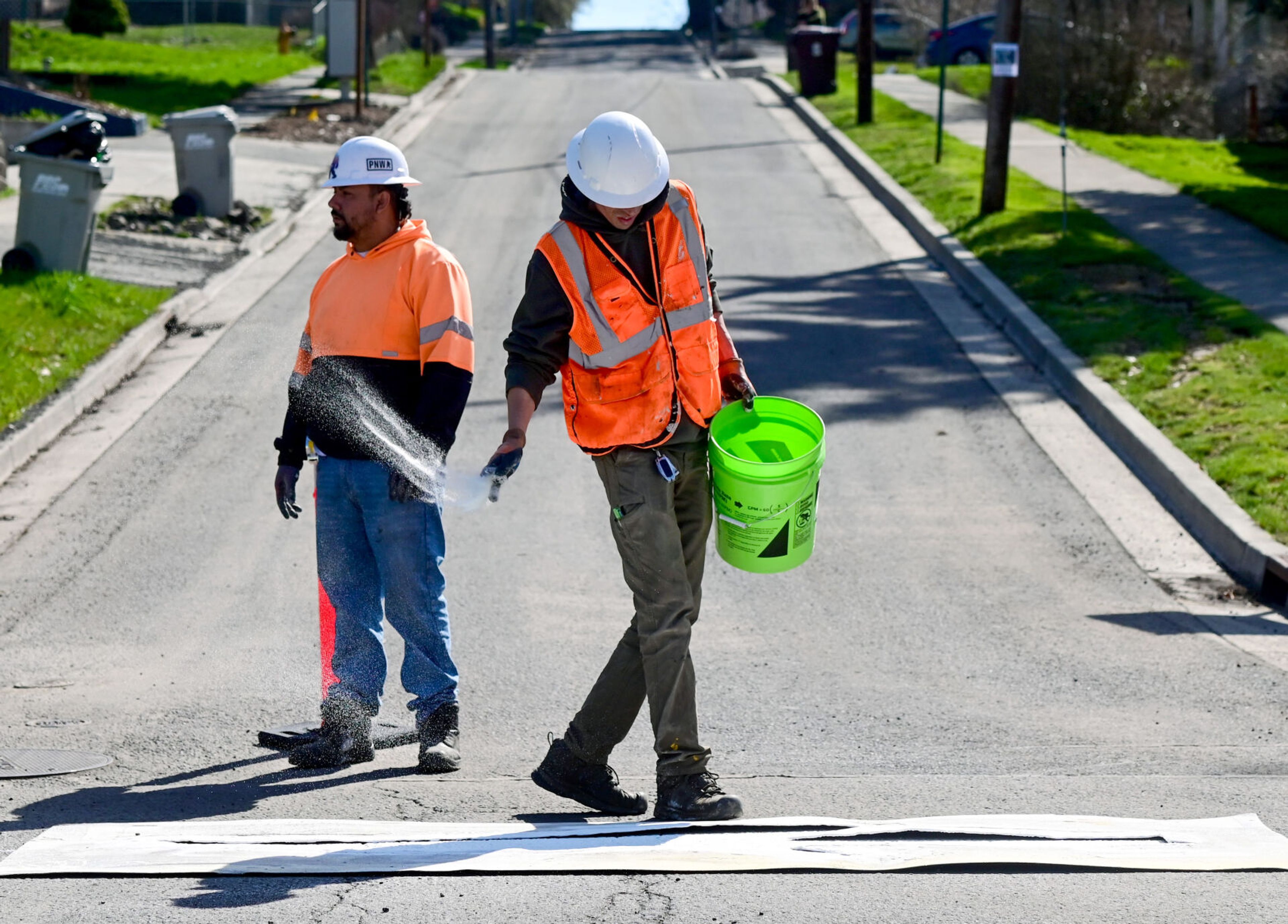 Directional arrows are painted along Paradise Street in Pullman on Monday in preparation of the street being used as a detour when Main Street is closed to vehicular traffic.