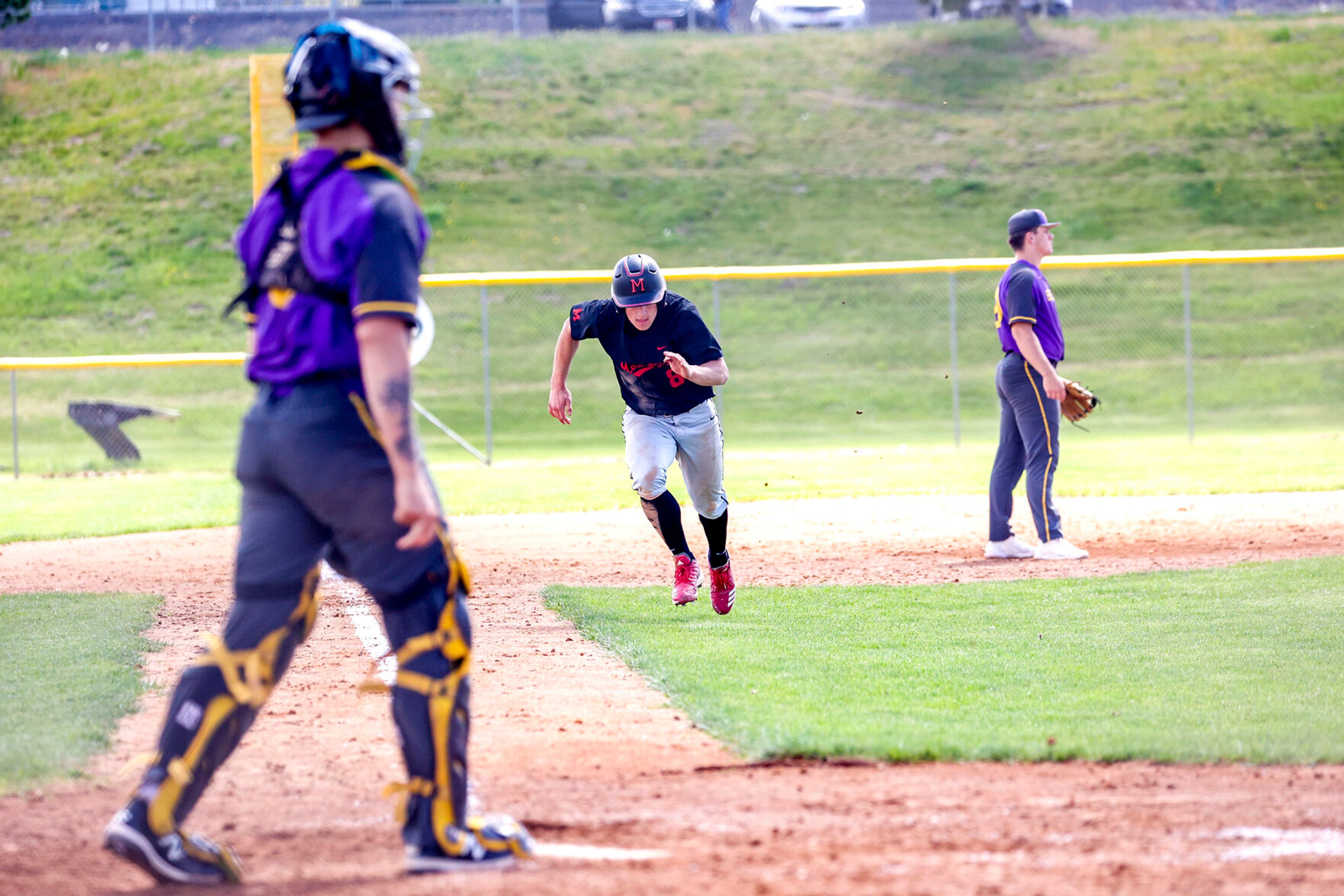 Moscow’s Chad Redinger takes off running for home at Church Field on Saturday. Lewiston defeated Moscow 6-4.