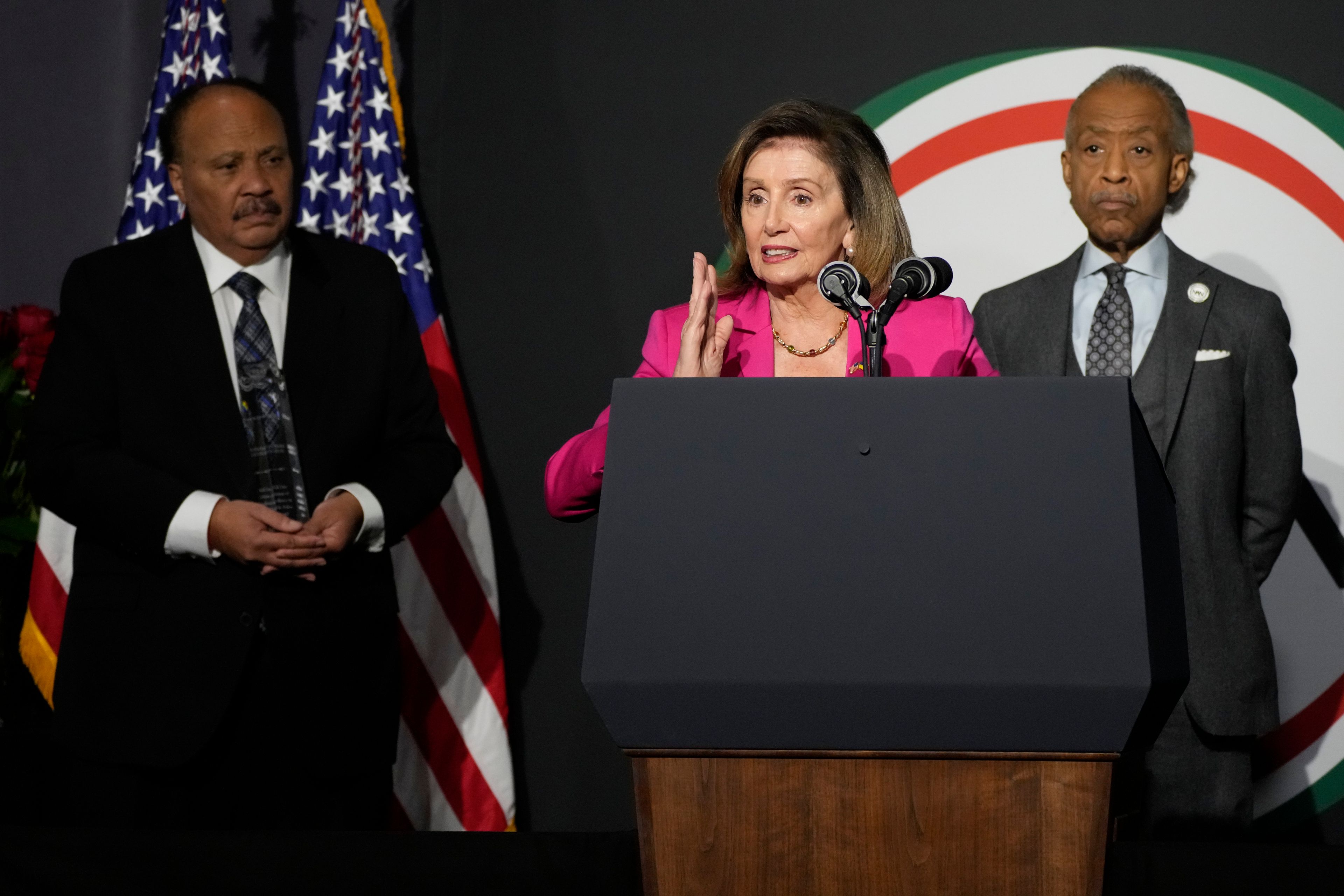 Rep. Nancy Pelosi, D-Calif., speaks at the National Action Network's Martin Luther King, Jr., Day breakfast, Monday, Jan. 16, 2023, in Washington. Martin Luther King III, the son of Martin Luther King Jr., left, and the Rev. Al Sharpton, right, look on. (AP Photo/Manuel Balce Ceneta)