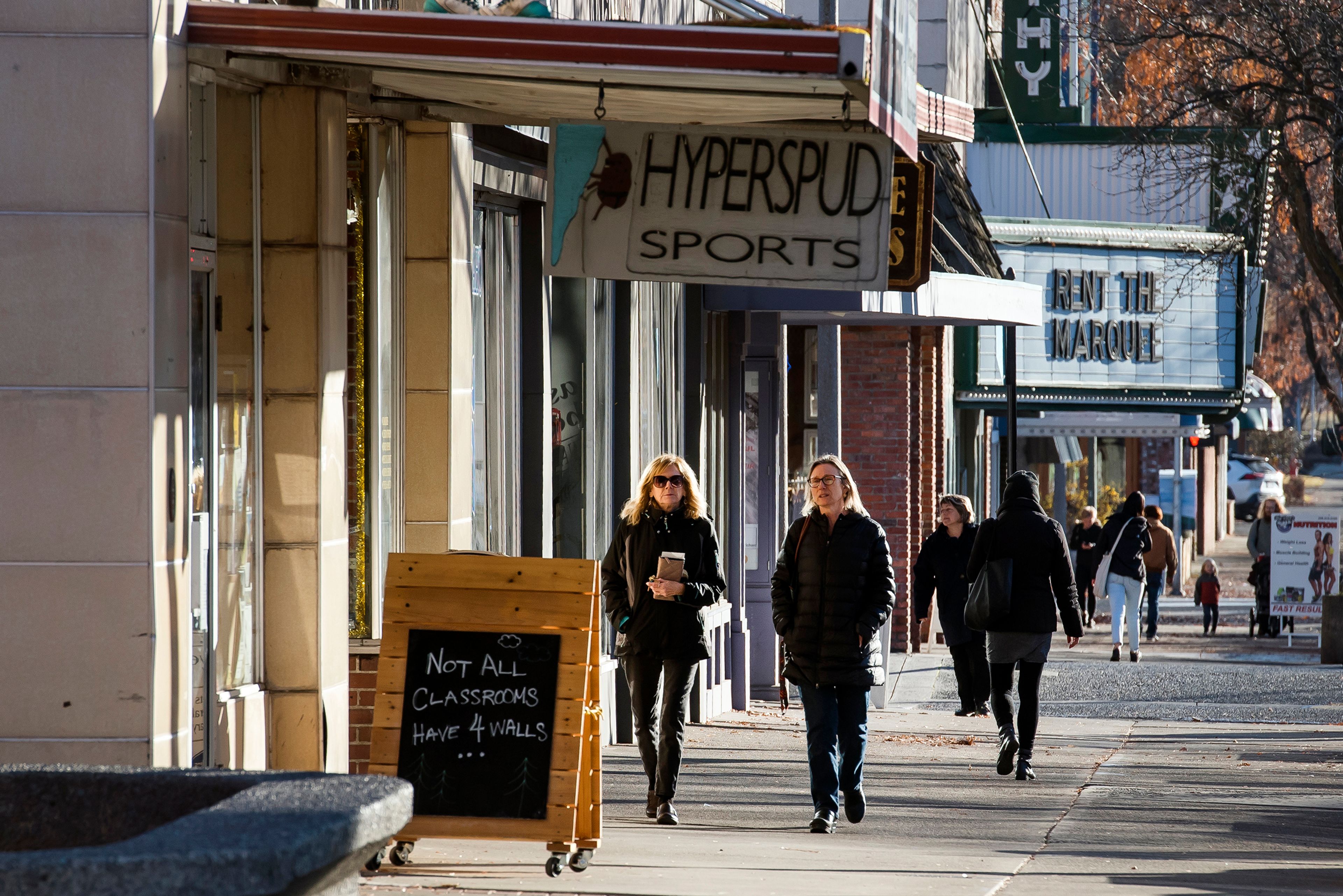 Pedestrians make their way up and down Main Street in downtown Moscow.