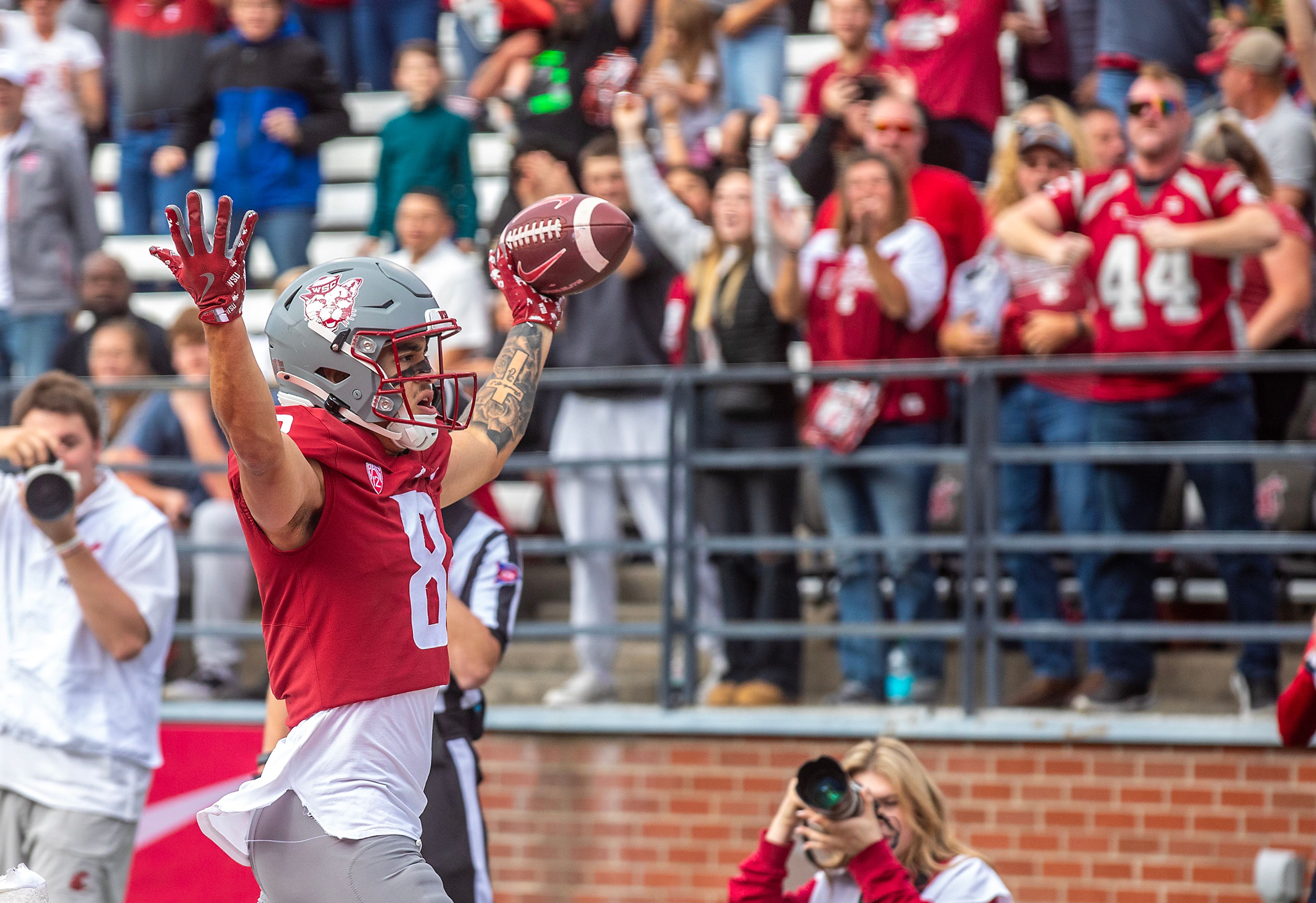 Washington State wide receiver Carlos Hernandez  celebrates a touchdown against Hawaii in a college football game on Saturday at Gesa Field in Pullman.,