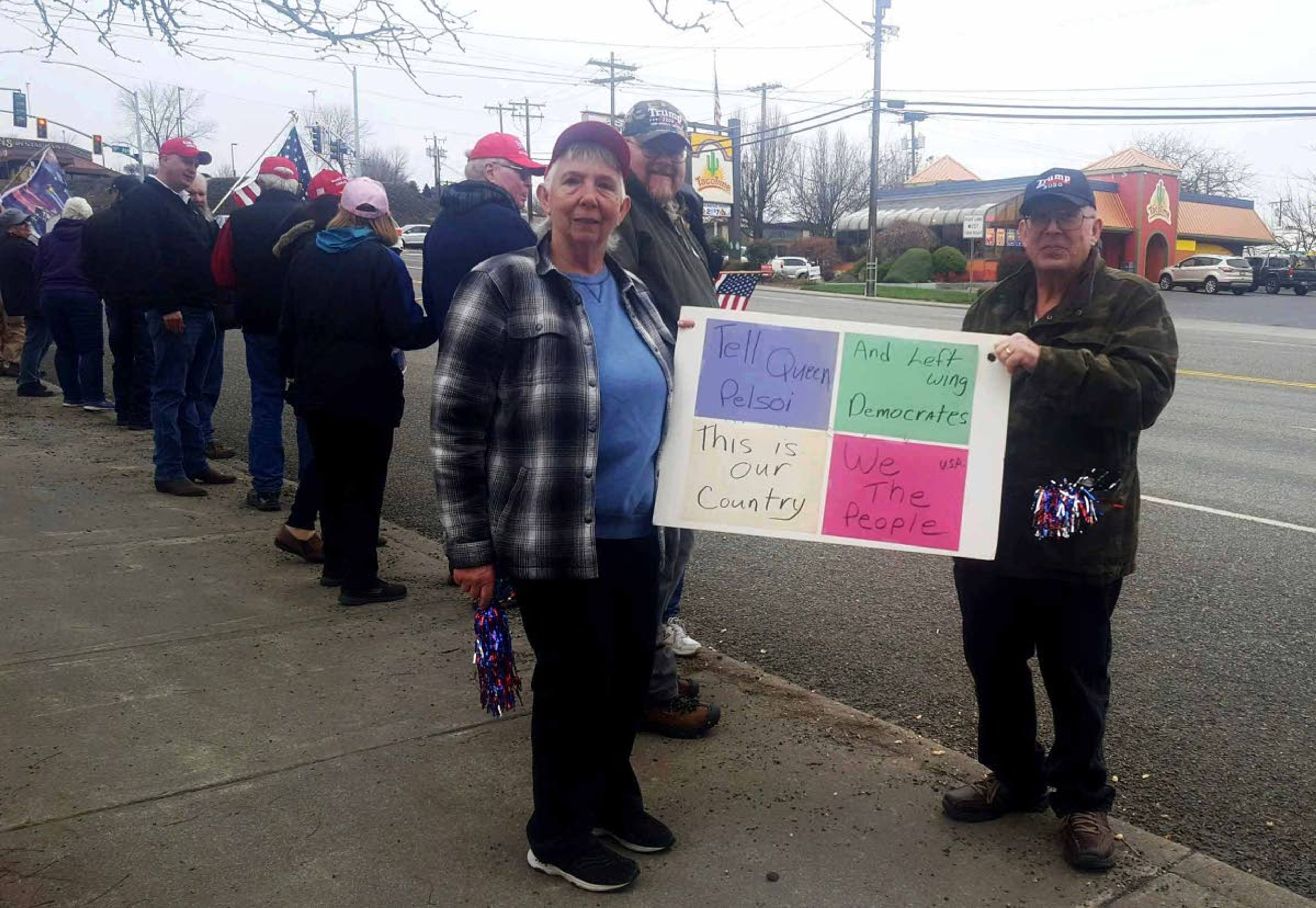 Elaine Williams/TribuneLinda and Doug Farrington of Lewiston stand with a sign they made for Republican event supporting President Donald Trump. The Farringtons were among more than 150 people who participated in the Saturday gathering in Lewiston.