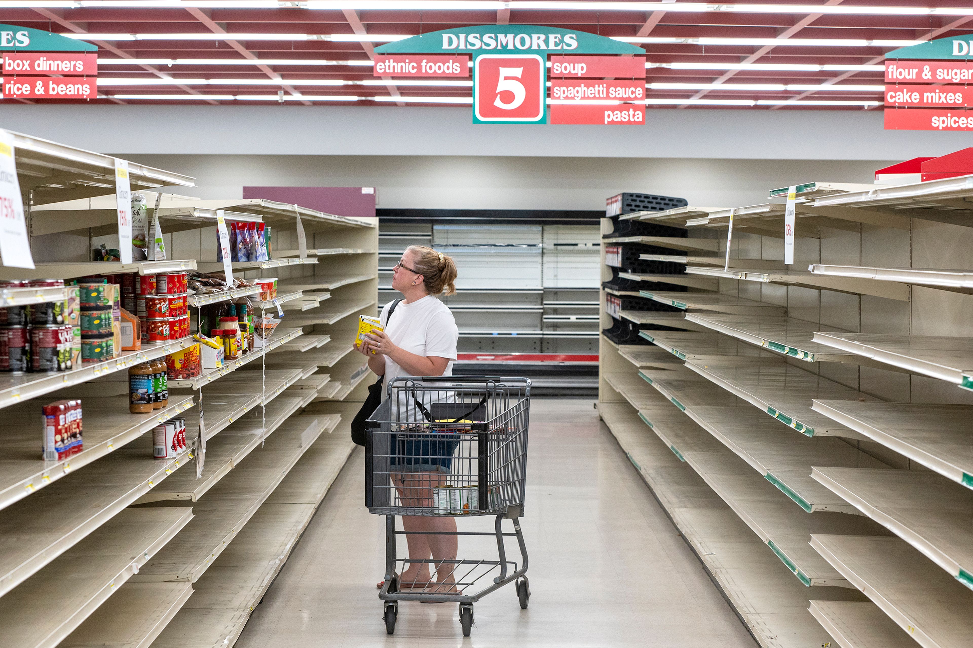 Zach Wilkinson/Daily NewsDevon Atkins browses through the few remaining items Friday at Dissmore’s IGA on the store’s final day in Pullman. “This is my first time shopping here, but I’ve always wanted to shop here. It’s sad, but I guess it’s my last time,” Atkins said.