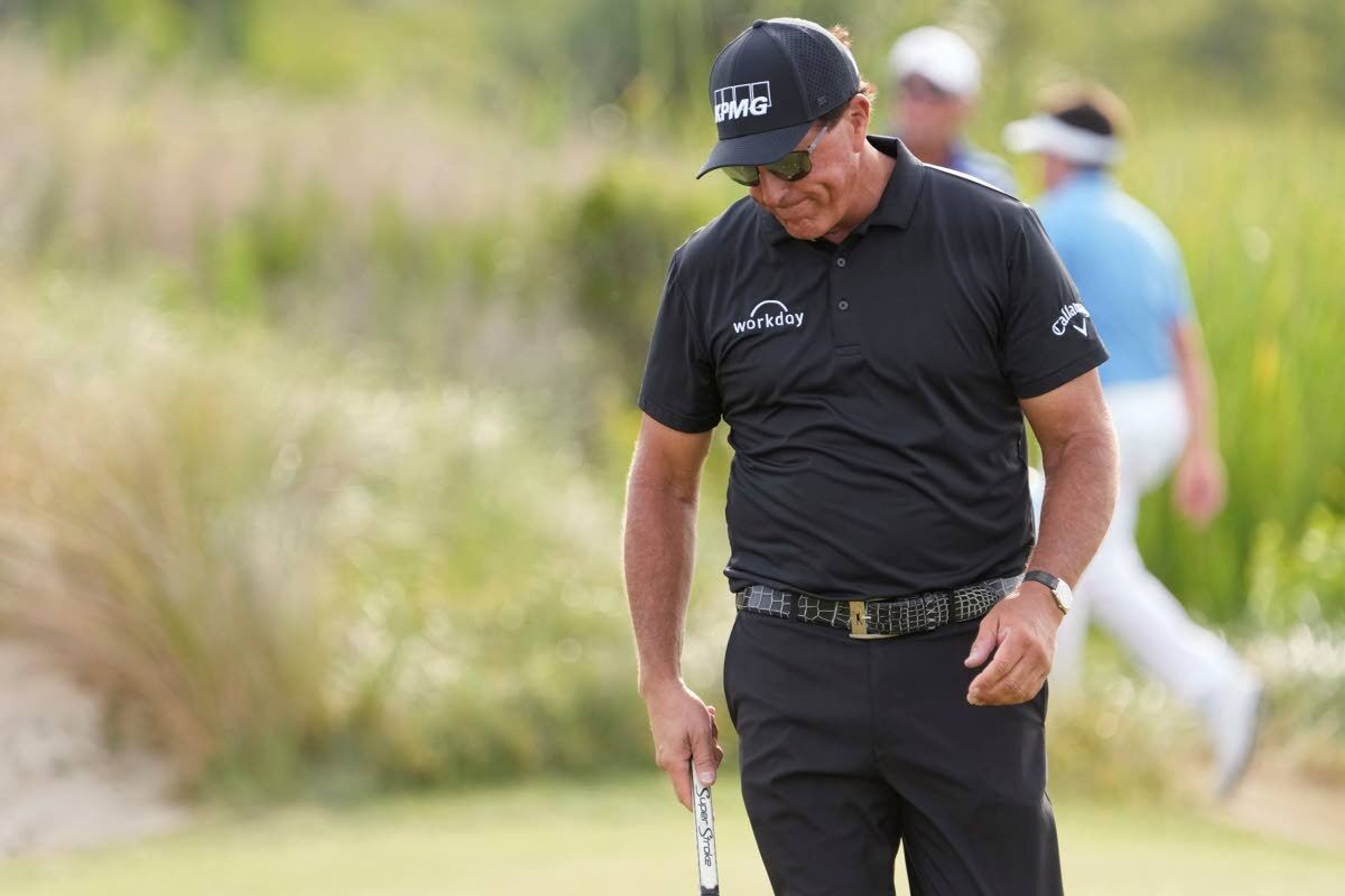 Phil Mickelson reacts after his double boggie shot on the 13th hole during the third round at the PGA Championship golf tournament on the Ocean Course, Saturday, May 22, 2021, in Kiawah Island, S.C. (AP Photo/David J. Phillip)