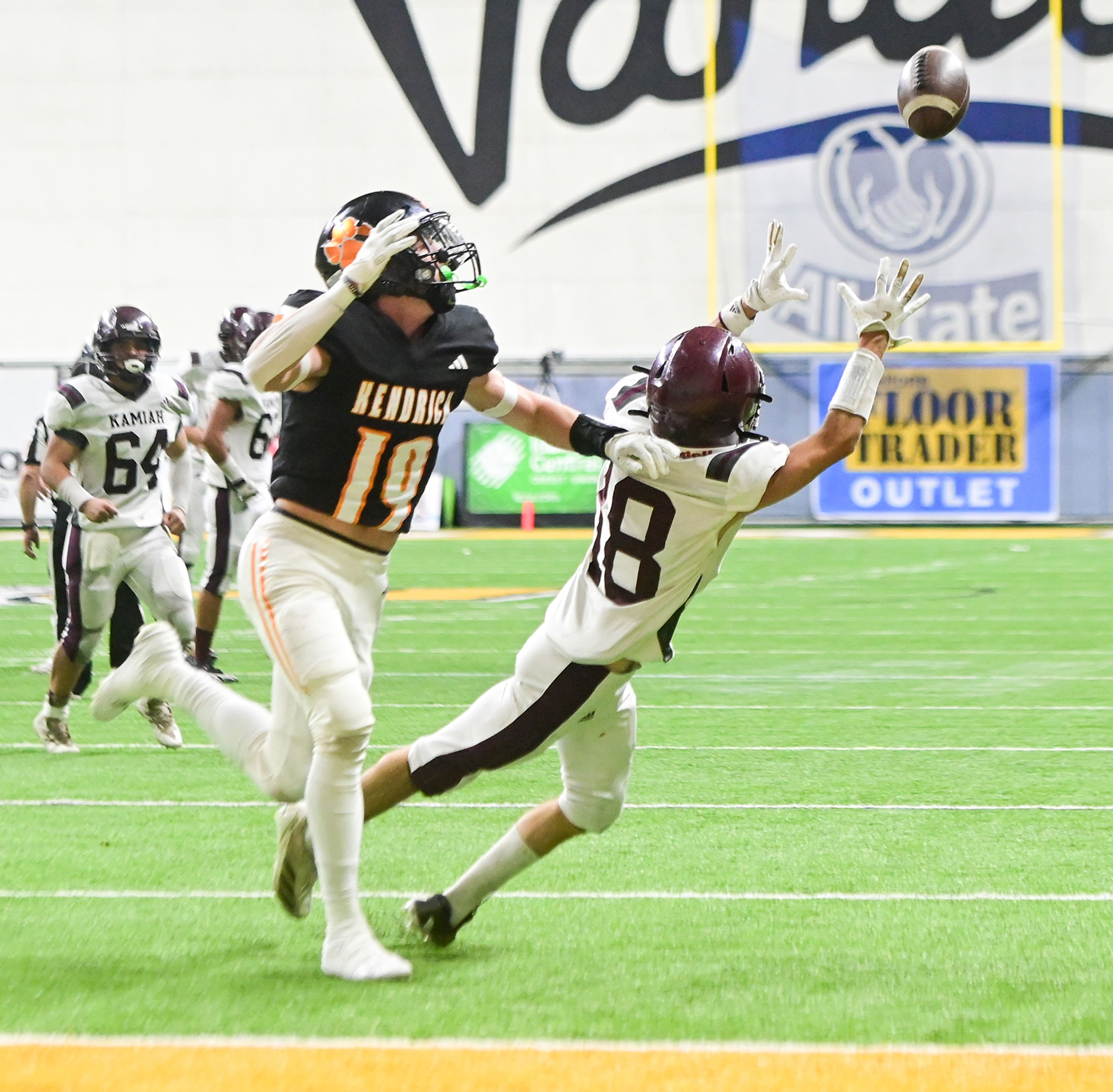 Kamiah’s Todd Roberts, right, defends against Kendrick’s Sawyer Hewett, left, during an Idaho Class 2A state quarterfinal game at the P1FCU Kibbie Dome in Moscow.