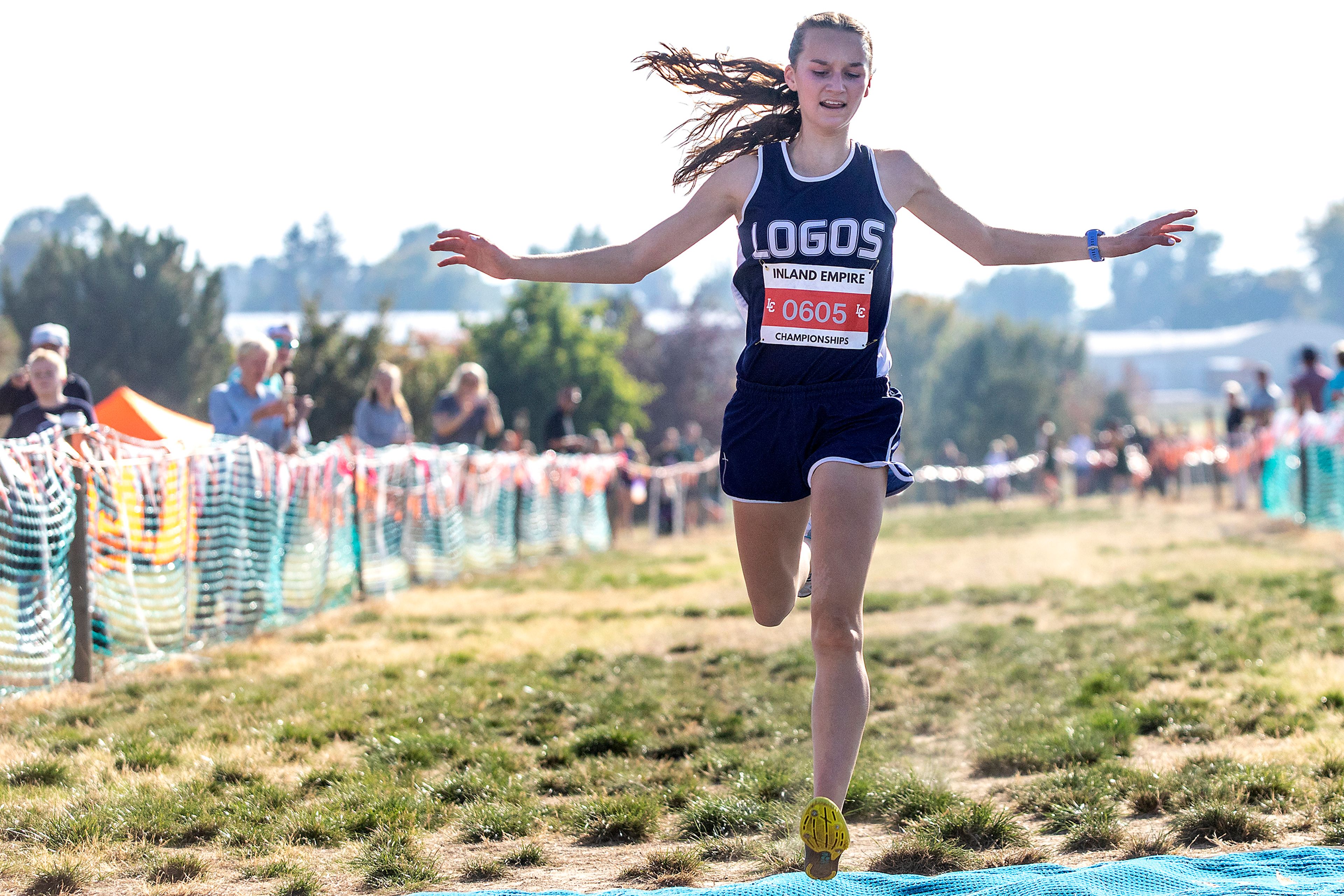 Logos’ Sara Casebolt crosses the line in first at the Class 1A district cross country meet in Lewiston on Wednesday.