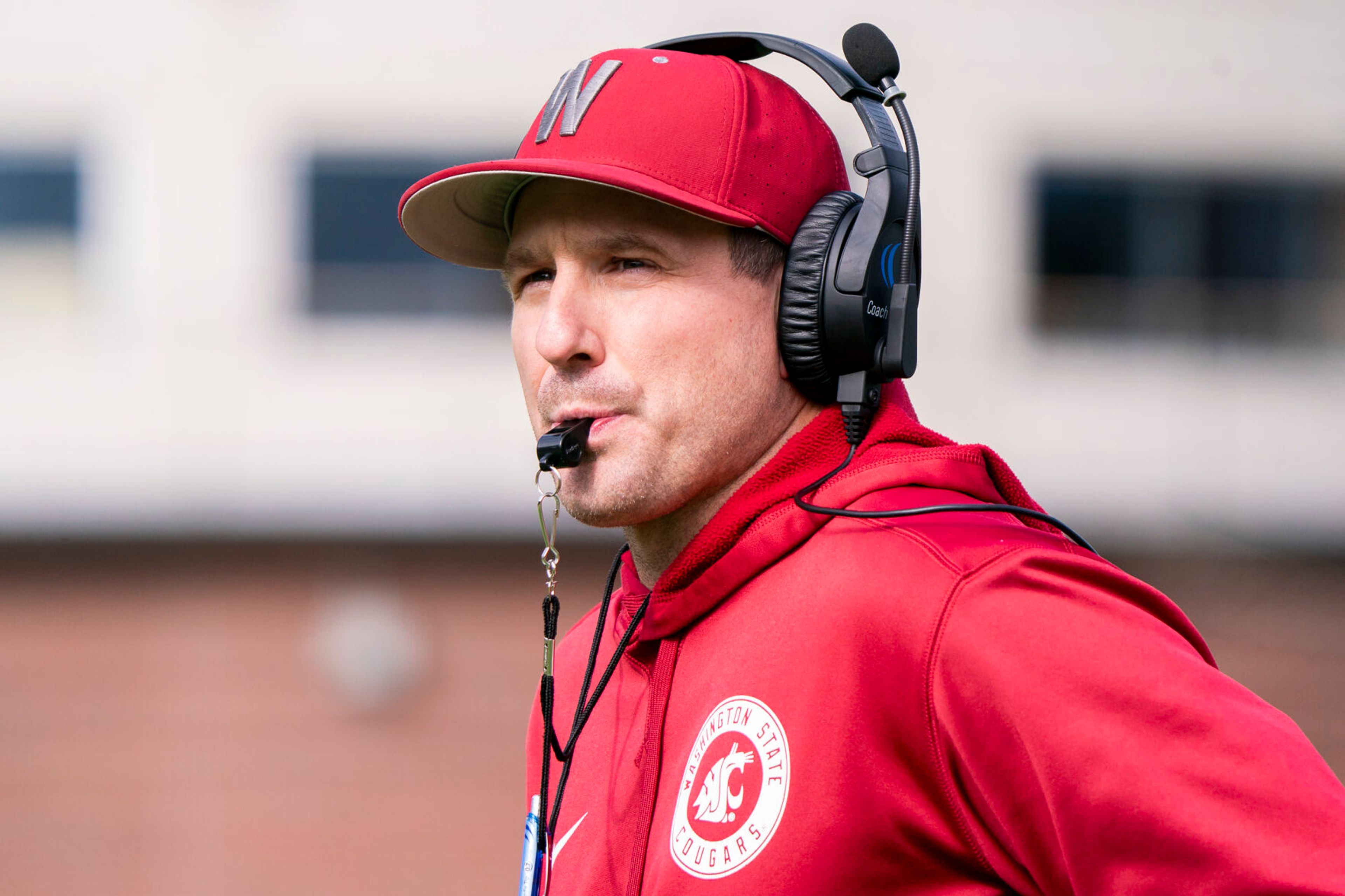 Washington State coach Jake Dickert watches his team during a practice April 9 in Pullman.