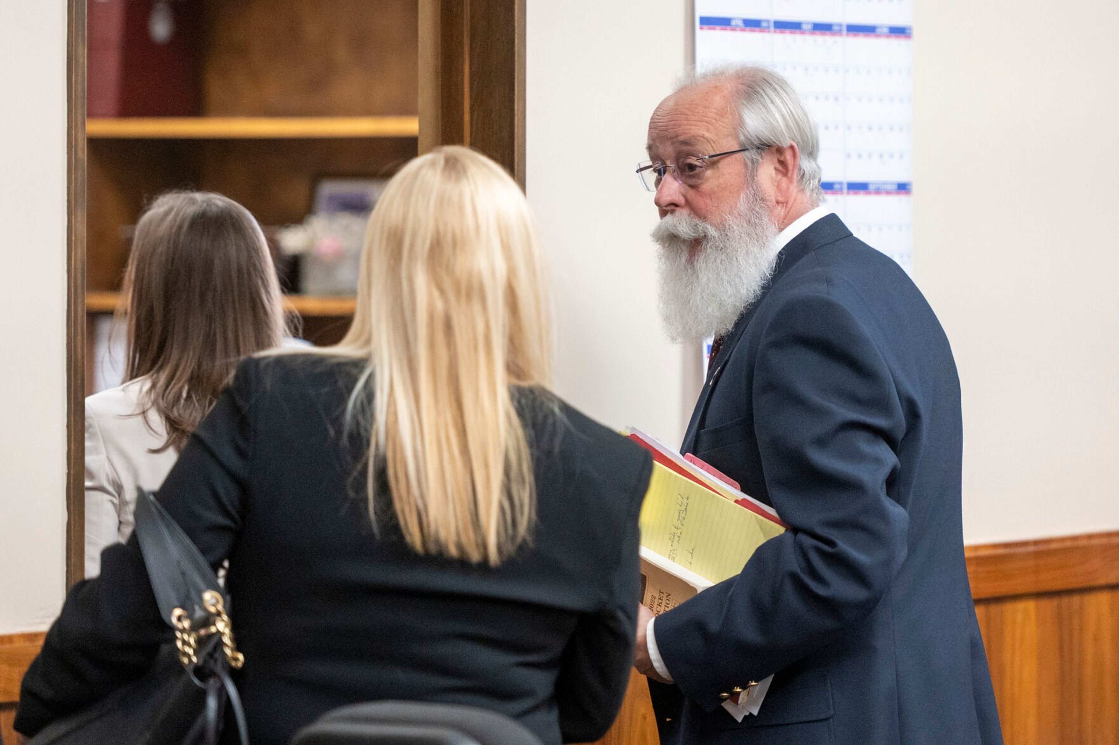 Latah County Prosecutor Bill Thompson, right, talks with defense attorney Anne Taylor on May 22, 2023.