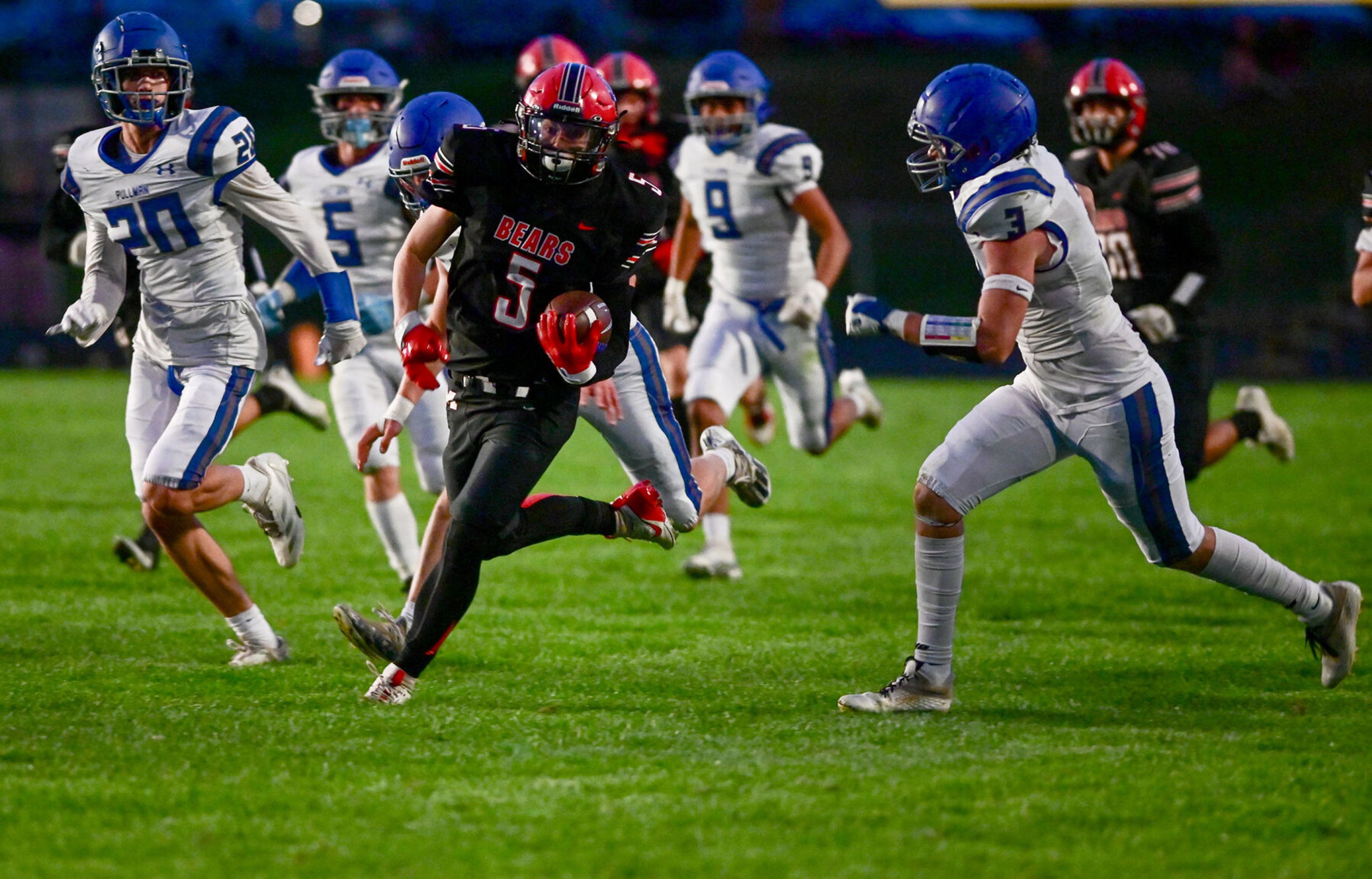 Moscow wide receiver Connor Isakson carries the ball downfield in a break-away play against Pullman Friday in Moscow.