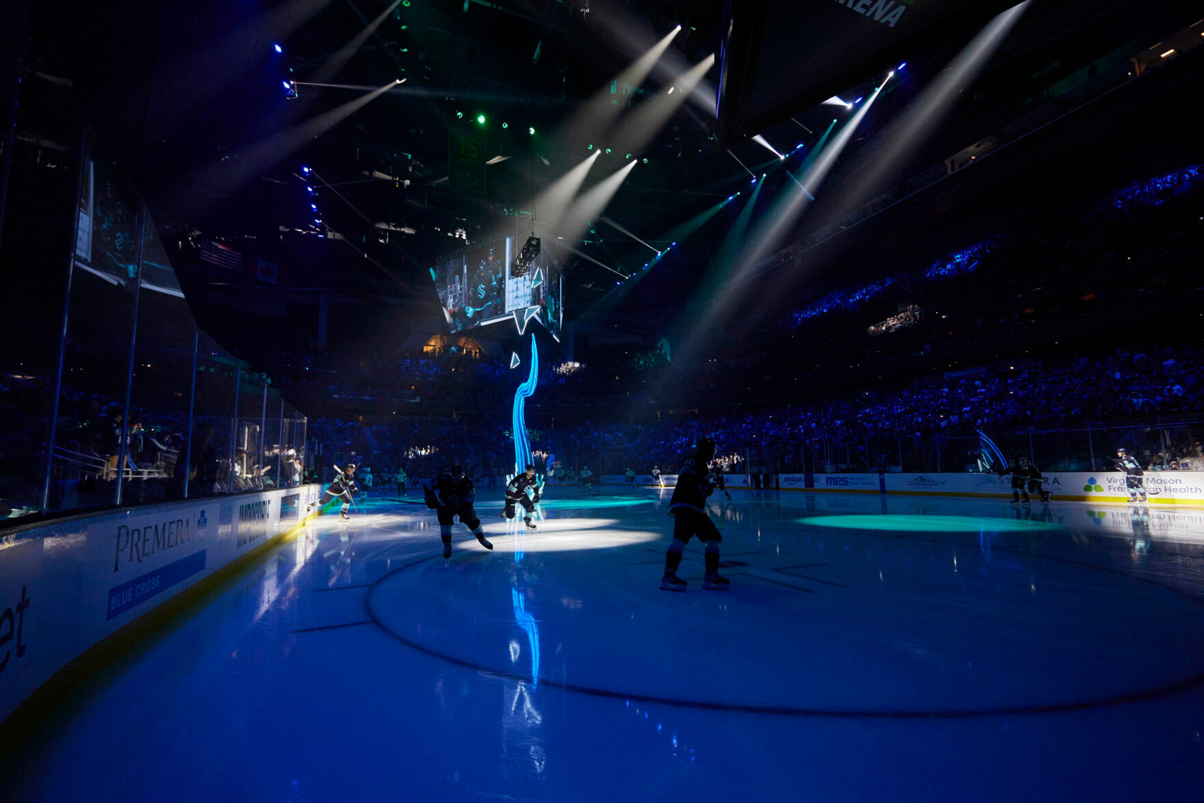 The pregame opening includes a light sculpture along with music as Seattle Kraken players are introduced before home NHL hockey games, Wednesday, Oct. 19, 2022, in Seattle. With Hollywood filmmaker Jerry Bruckheimer as part of the ownership group, the Seattle Kraken were always going to have a big cinematic element to any video production the team produced. An original compostion by Grammy and Oscar Award winning composer Hans Zimmer was created specifically for the Kraken. (AP Photo/John Froschauer)