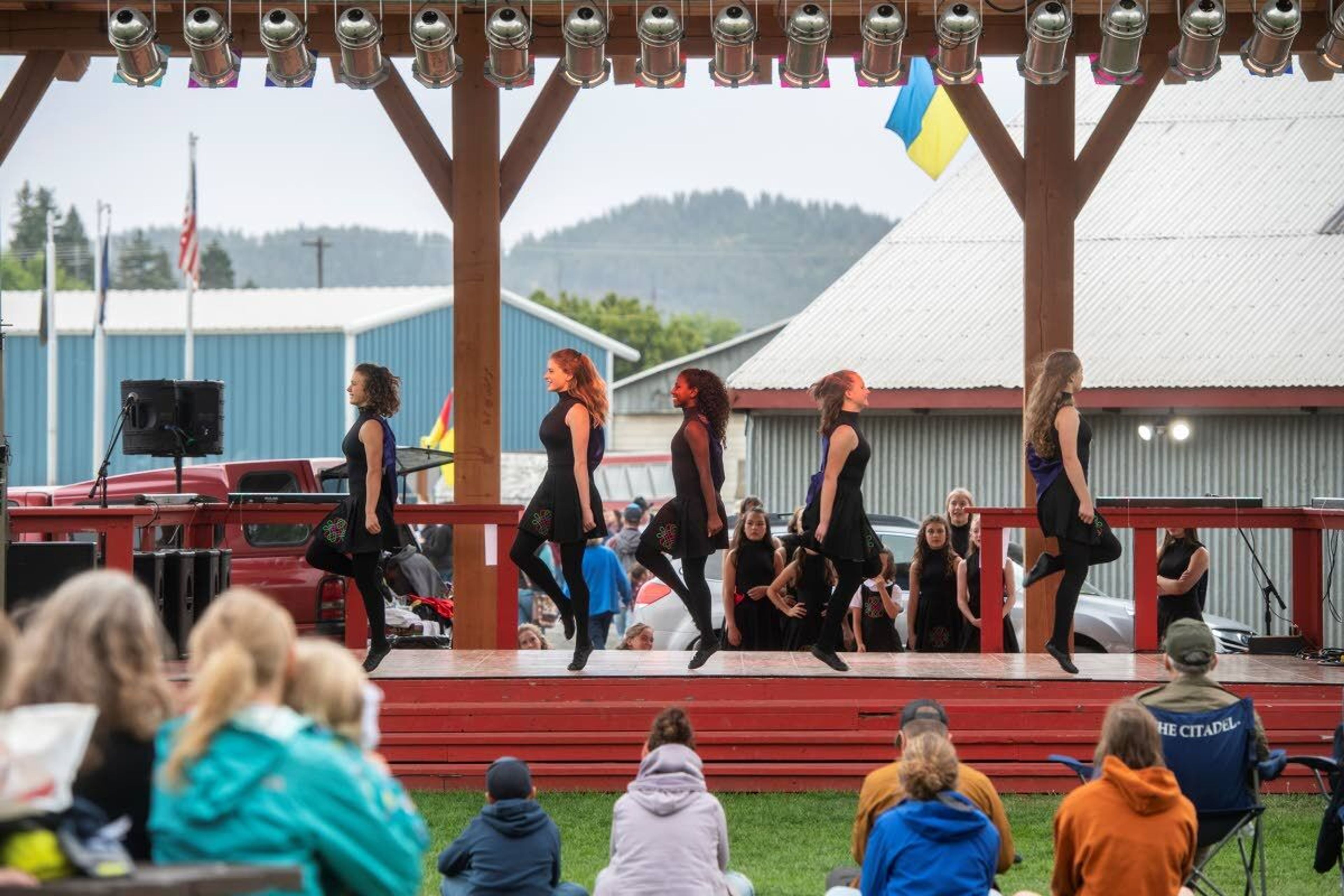 Members of the Rince Na Gra School of Irish Dance perform on the main stage in front of an audience at the Latah County Fair on Saturday morning in Moscow. The annual fair continues today, come rain (probable) or shine (possibly in short supply).