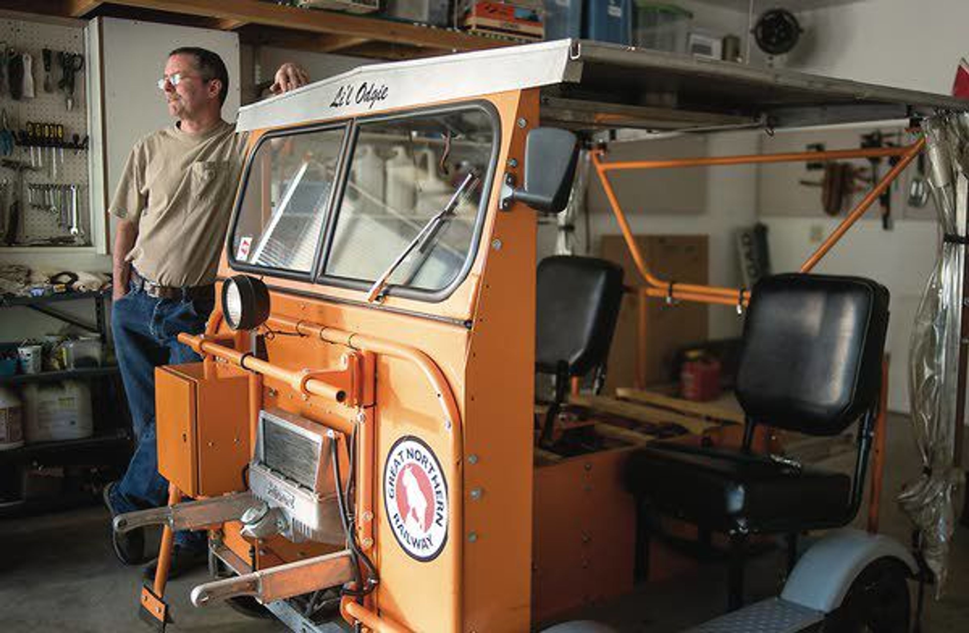 Roger Farrell talks about road trips on his speeder Wednesday in Albion. The speeder, Li'l Odge, used to be full of weeds and in pieces until Farrell fixed it up.