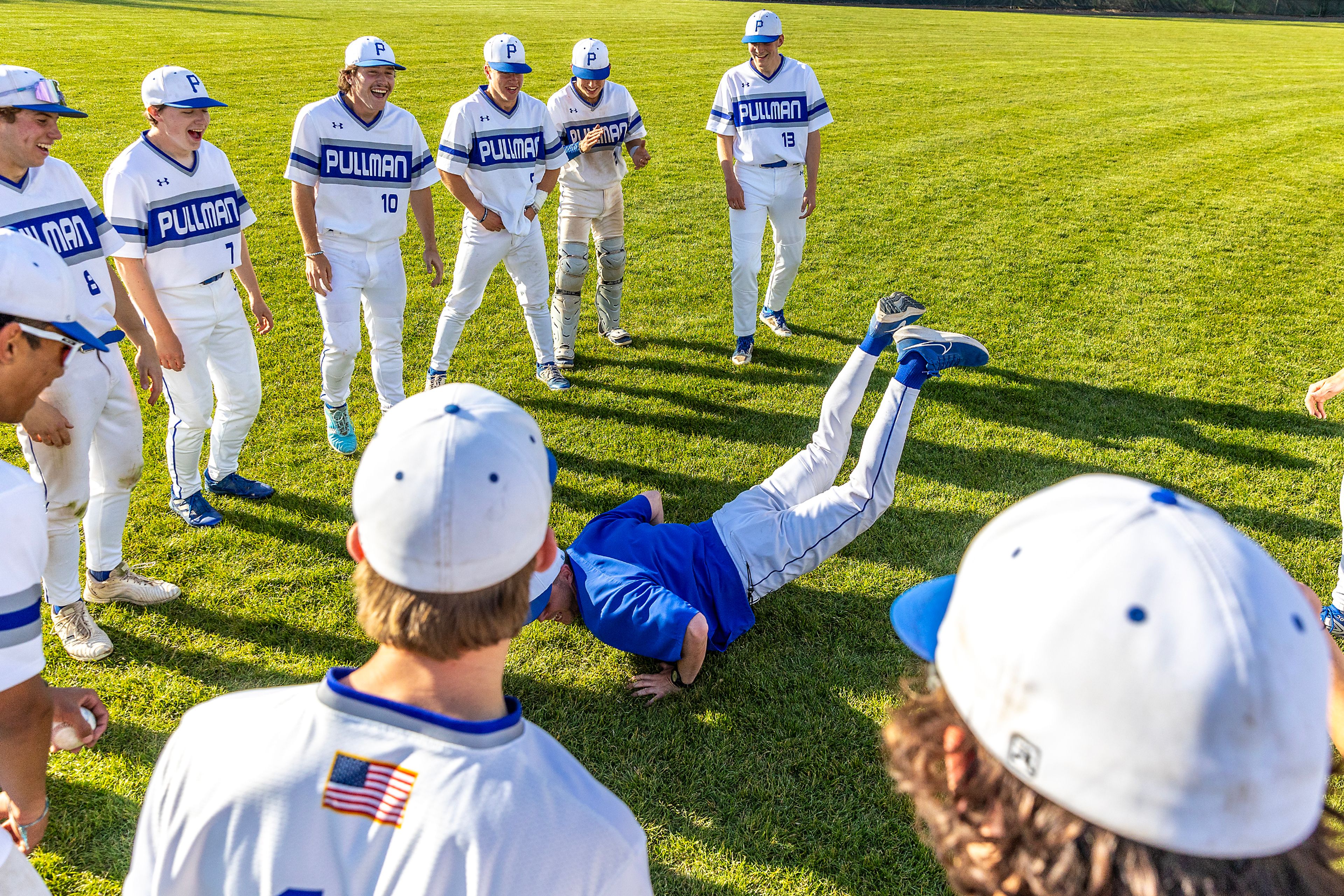 A Pullman coach does the worm after the team’s victory over Clarkston in a semifinal game of the district tournament Thursday in Pullman.