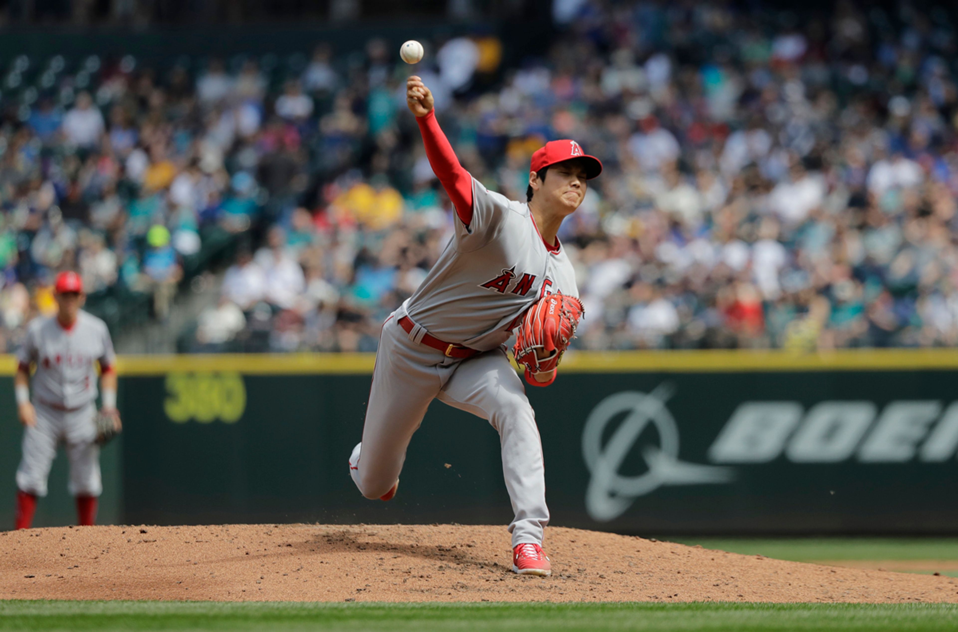 Angels starting pitcher Shohei Ohtani throws against the Mariners in the third inning of a baseball game Sunday in Seattle.