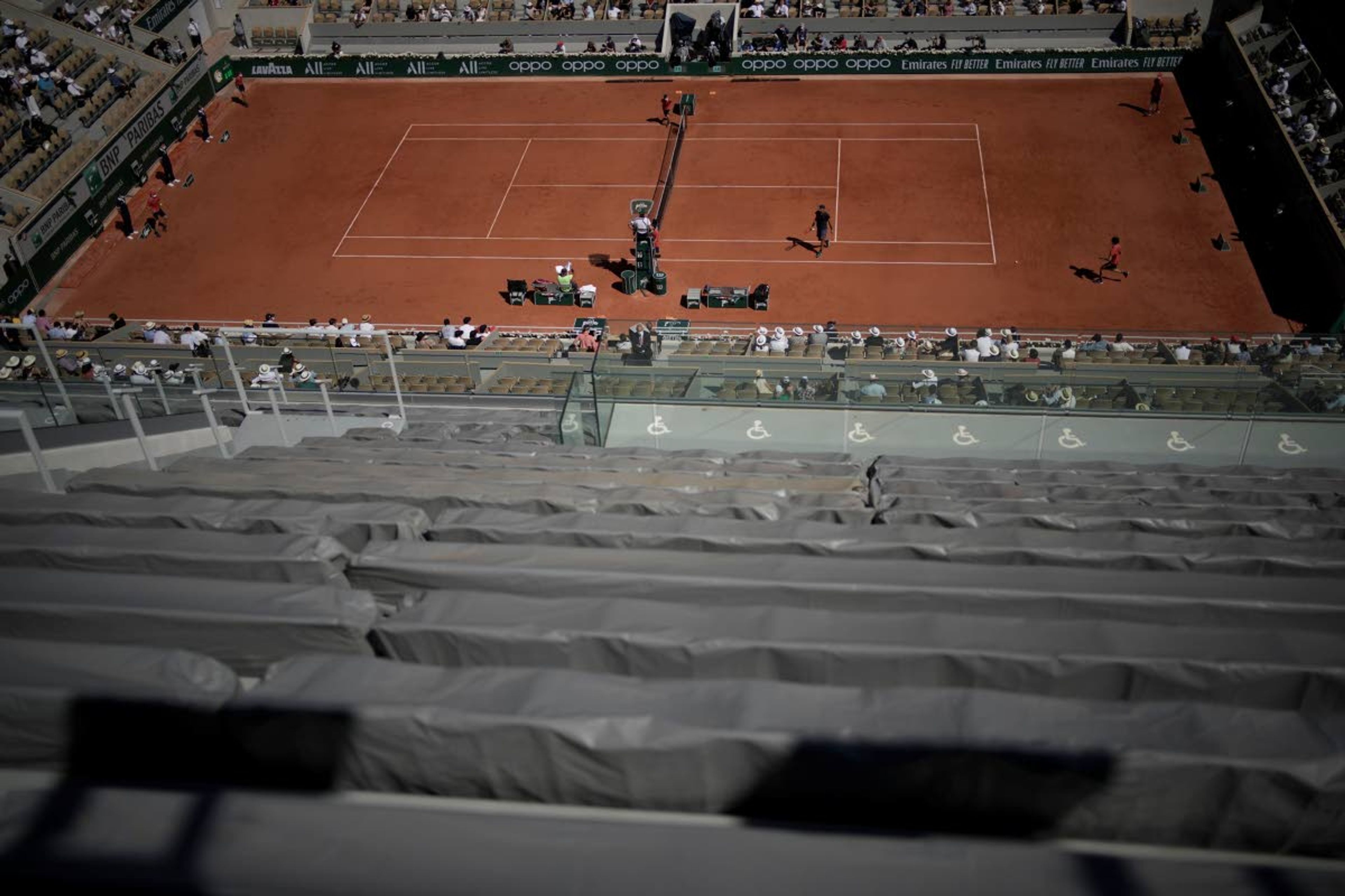 Spain's Rafael Nadal, left of the umpires chair gets ready to play Australia's Alexei Popyrin for their first round match on day three of the French Open tennis tournament at Roland Garros in Paris, France, Tuesday, June 1, 2021. (AP Photo/Christophe Ena)