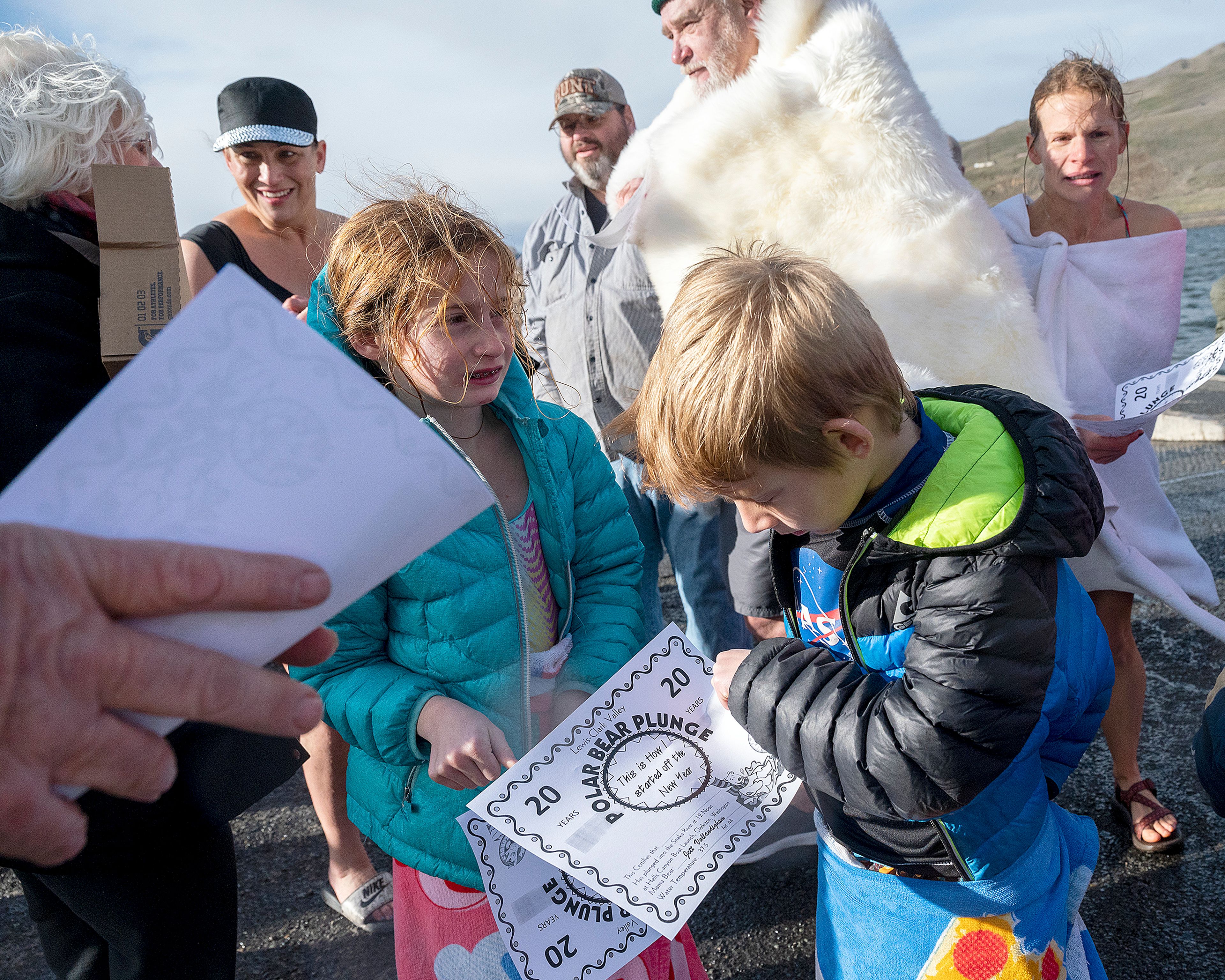 Certificates were handed out to the young and old who braved the frigid temperatures of the Snake River after the annual Polar Plunge in Clarkston on Wednesday.